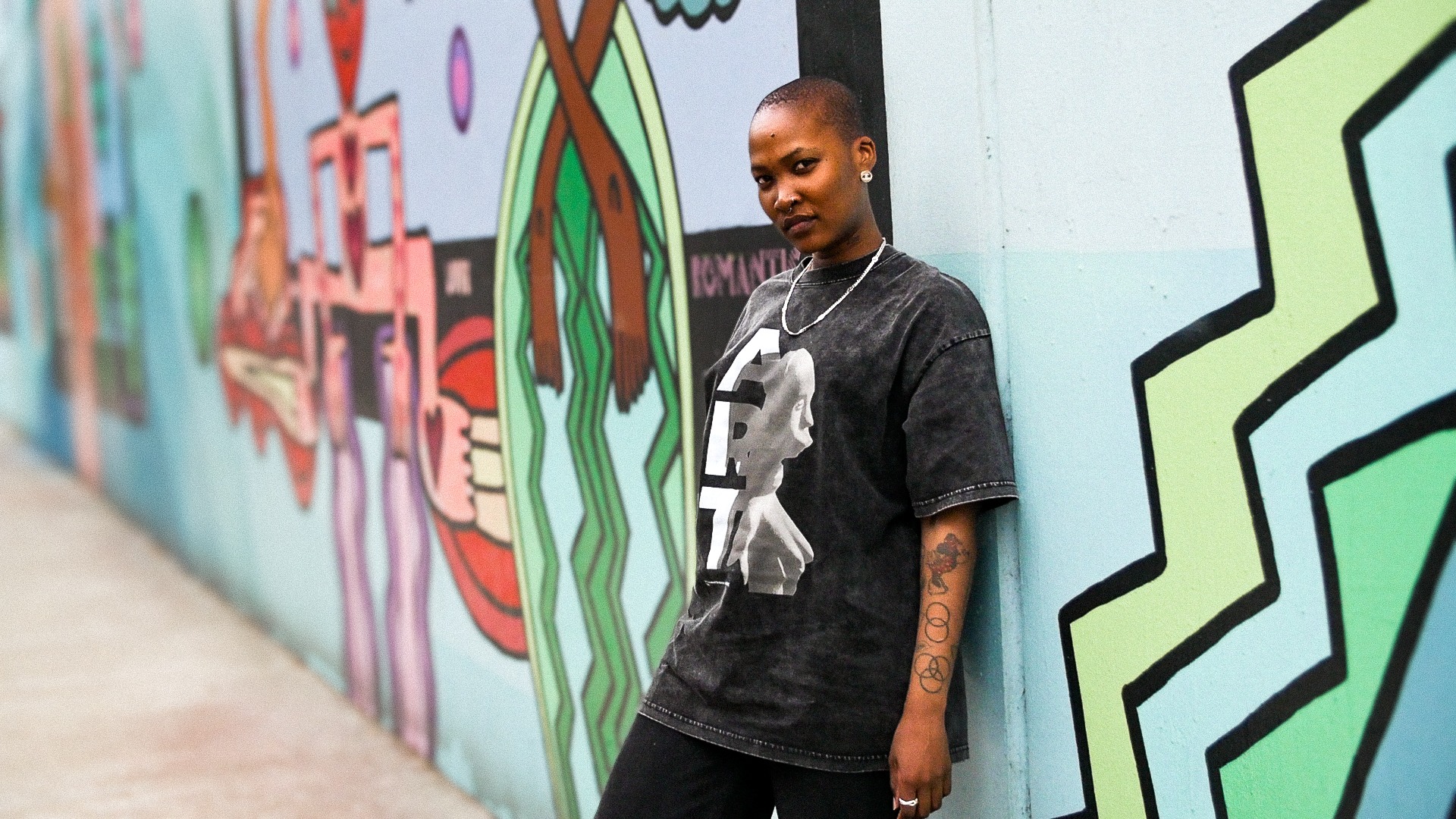 an abstract photo of a curved building with a blue sky in the background