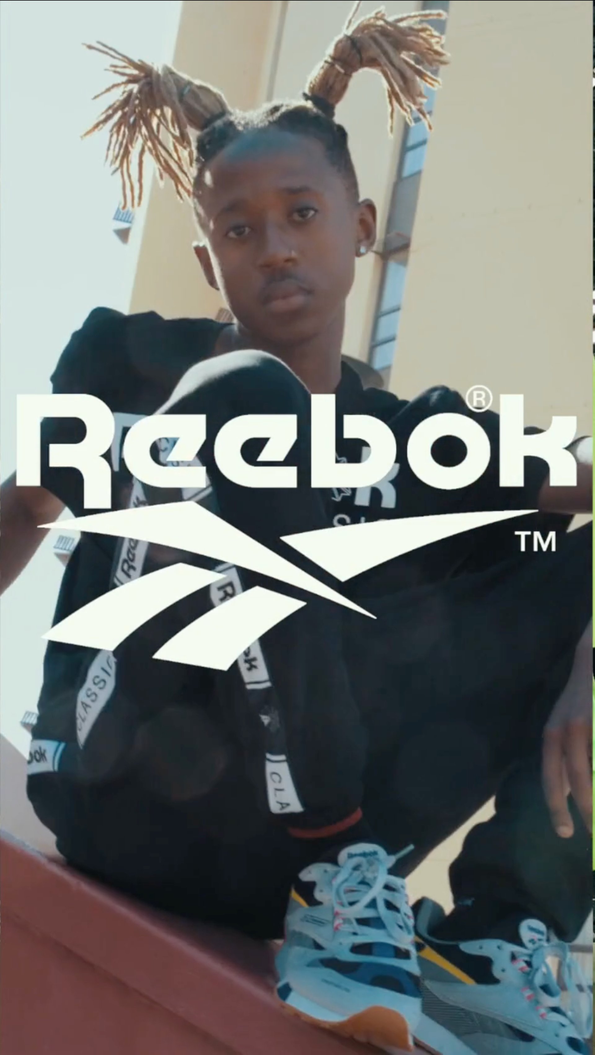 an abstract photo of a curved building with a blue sky in the background