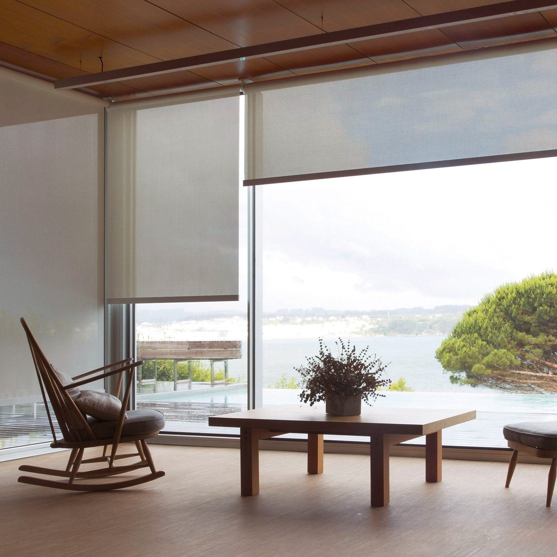 an abstract photo of a curved building with a blue sky in the background