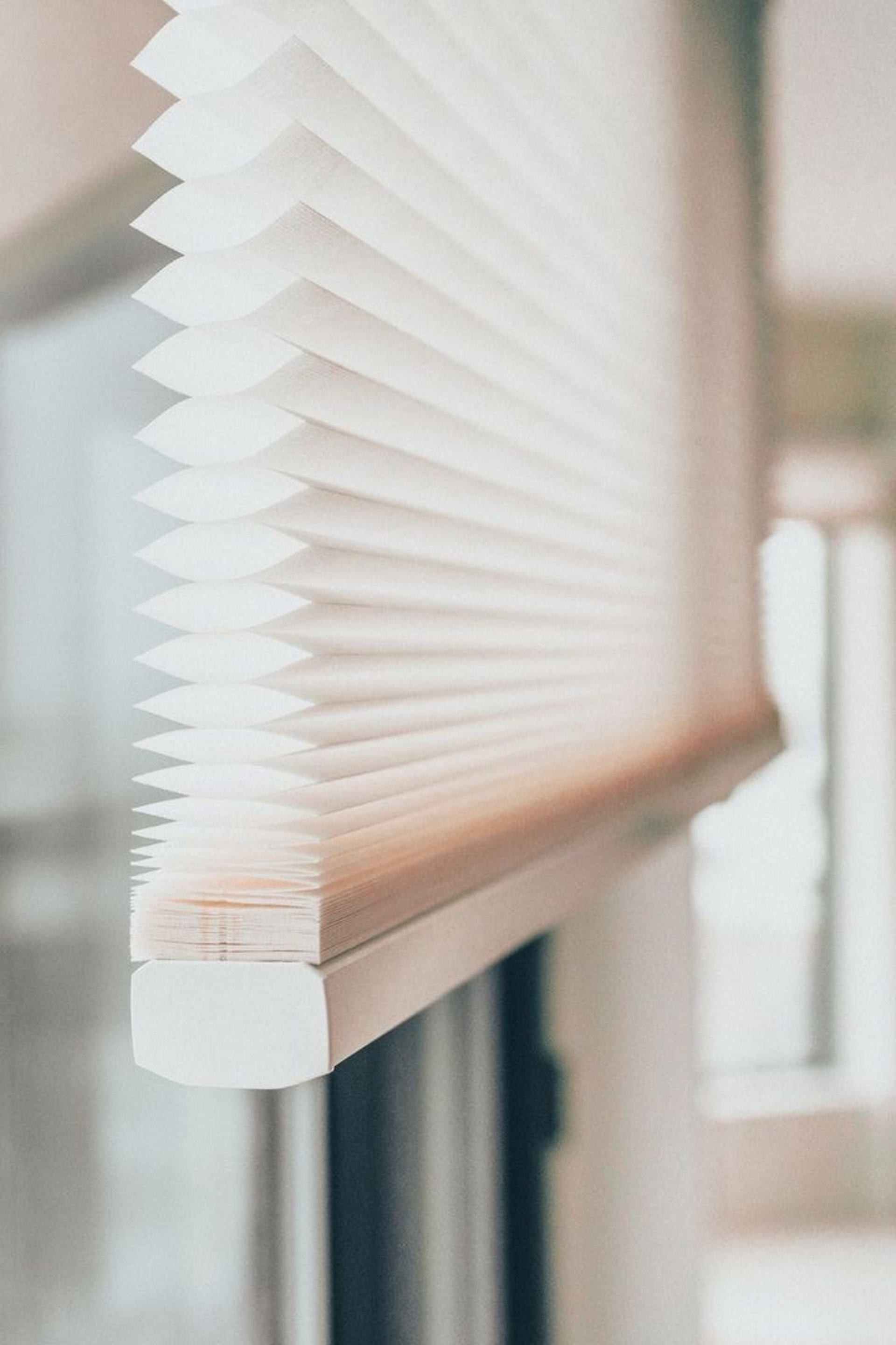 an abstract photo of a curved building with a blue sky in the background