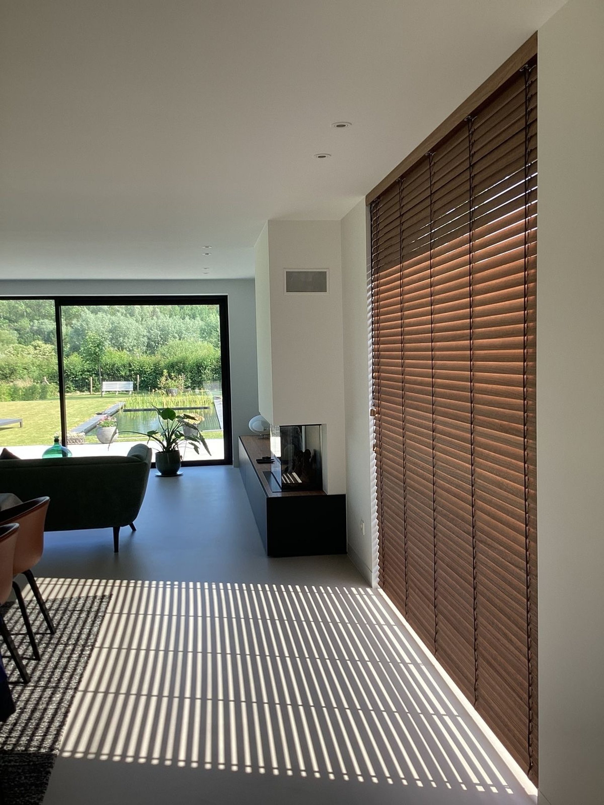 an abstract photo of a curved building with a blue sky in the background