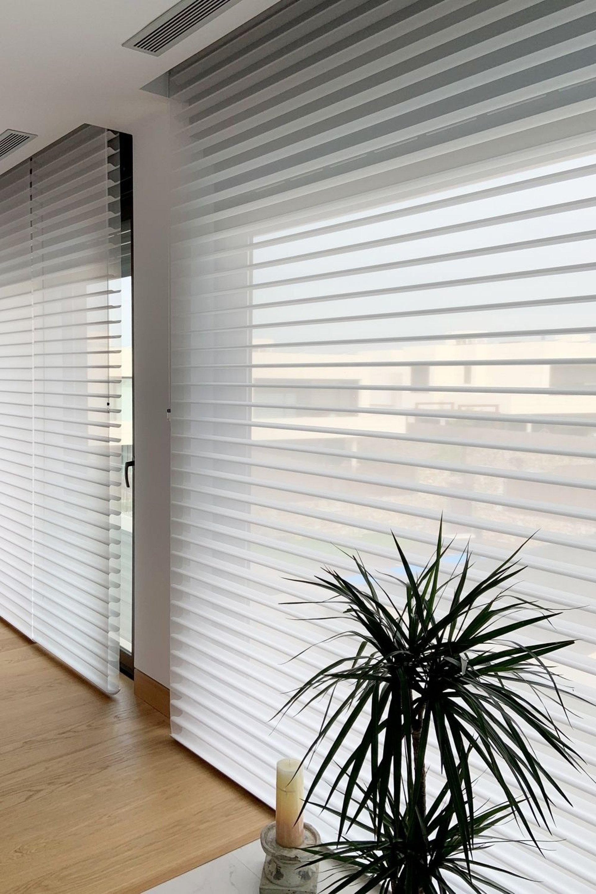 an abstract photo of a curved building with a blue sky in the background