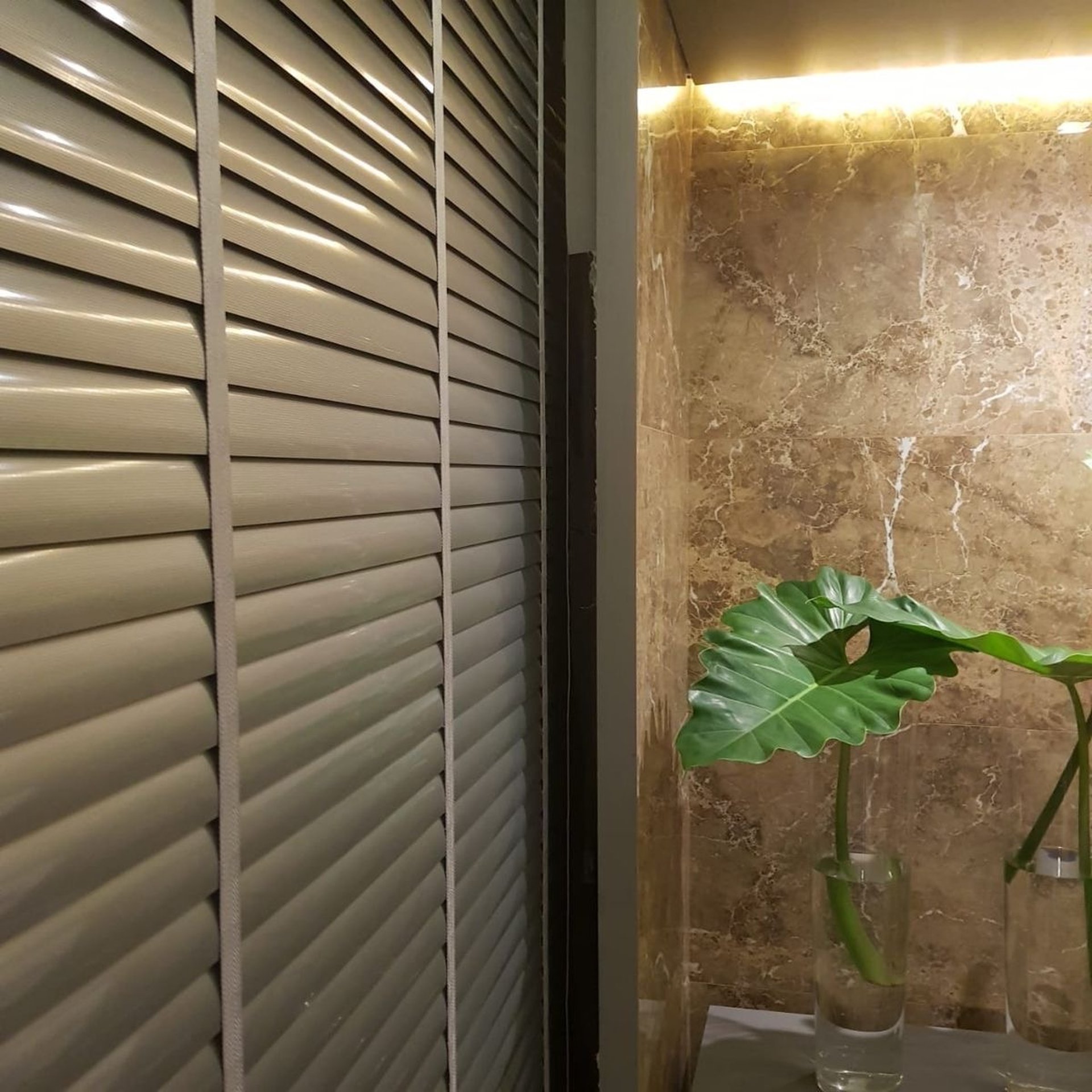 an abstract photo of a curved building with a blue sky in the background