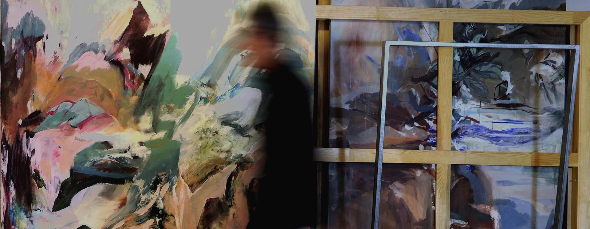 an abstract photo of a curved building with a blue sky in the background