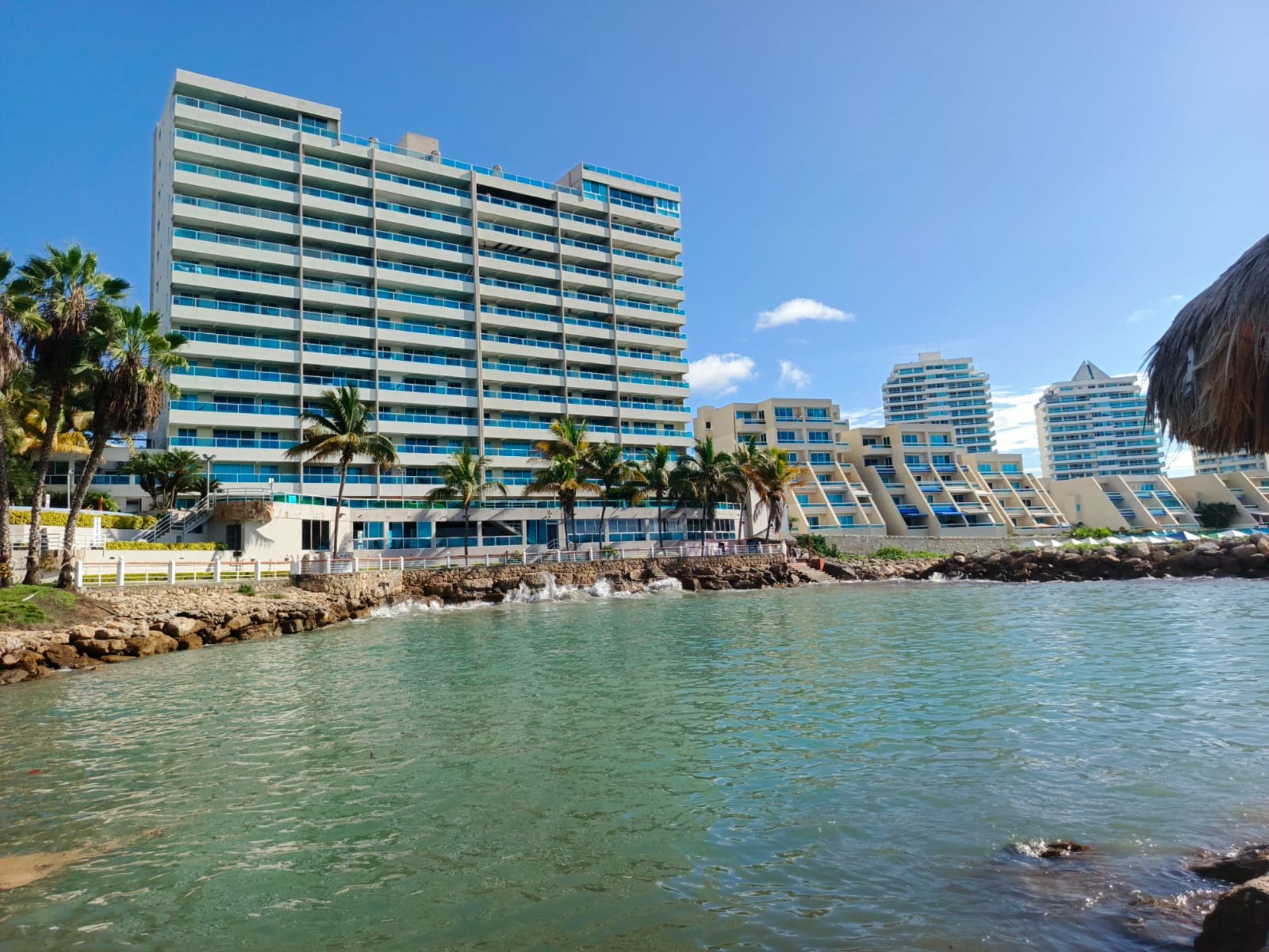 woman wearing yellow long-sleeved dress under white clouds and blue sky during daytime