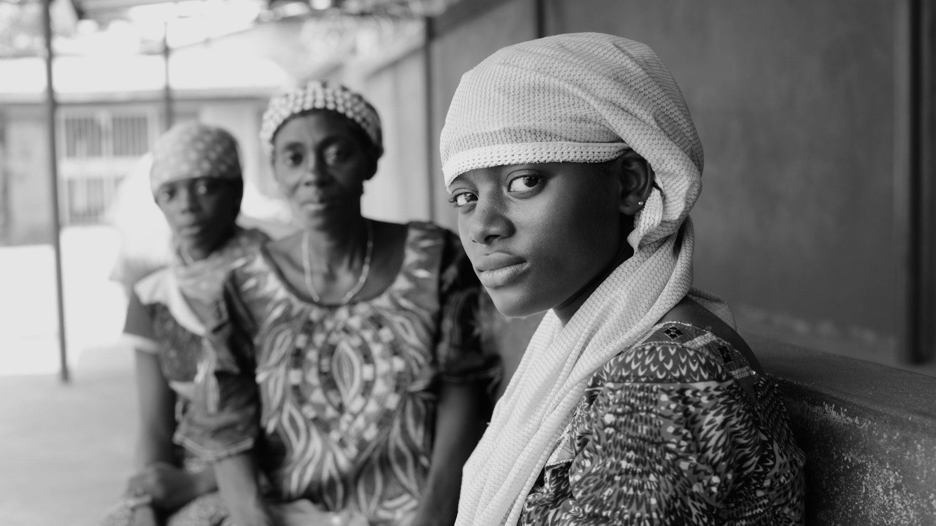 Woman from Guinea looking at the camera.