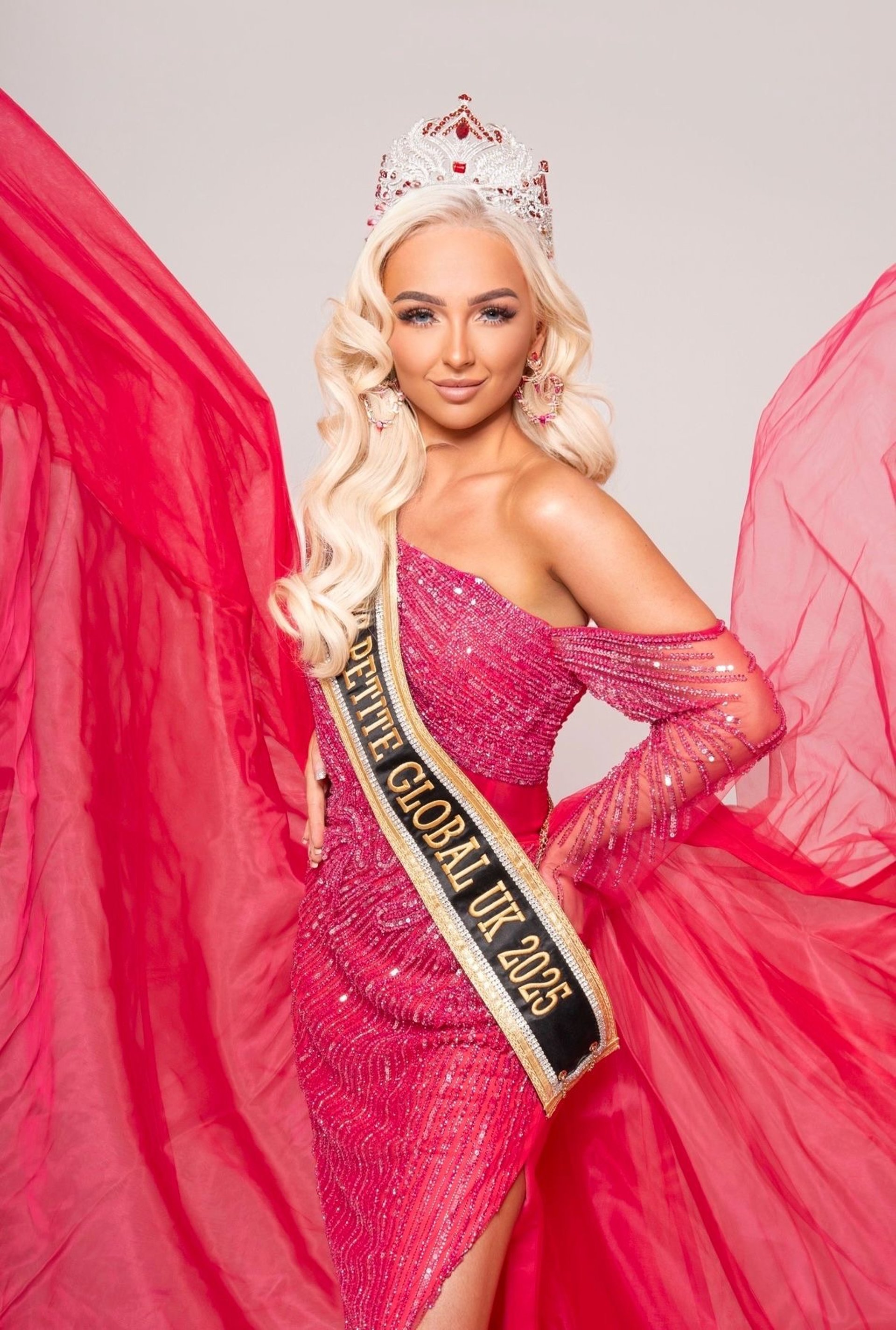 woman wearing yellow long-sleeved dress under white clouds and blue sky during daytime