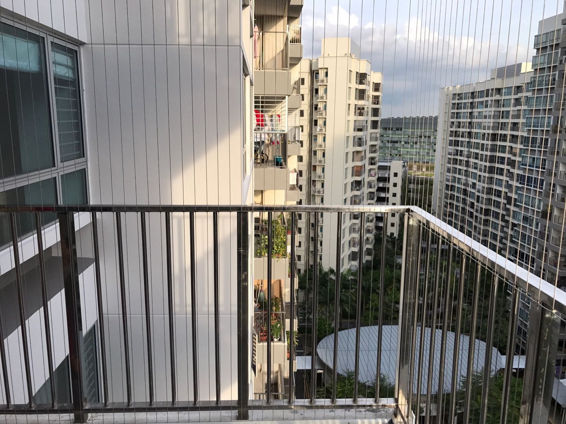 an abstract photo of a curved building with a blue sky in the background