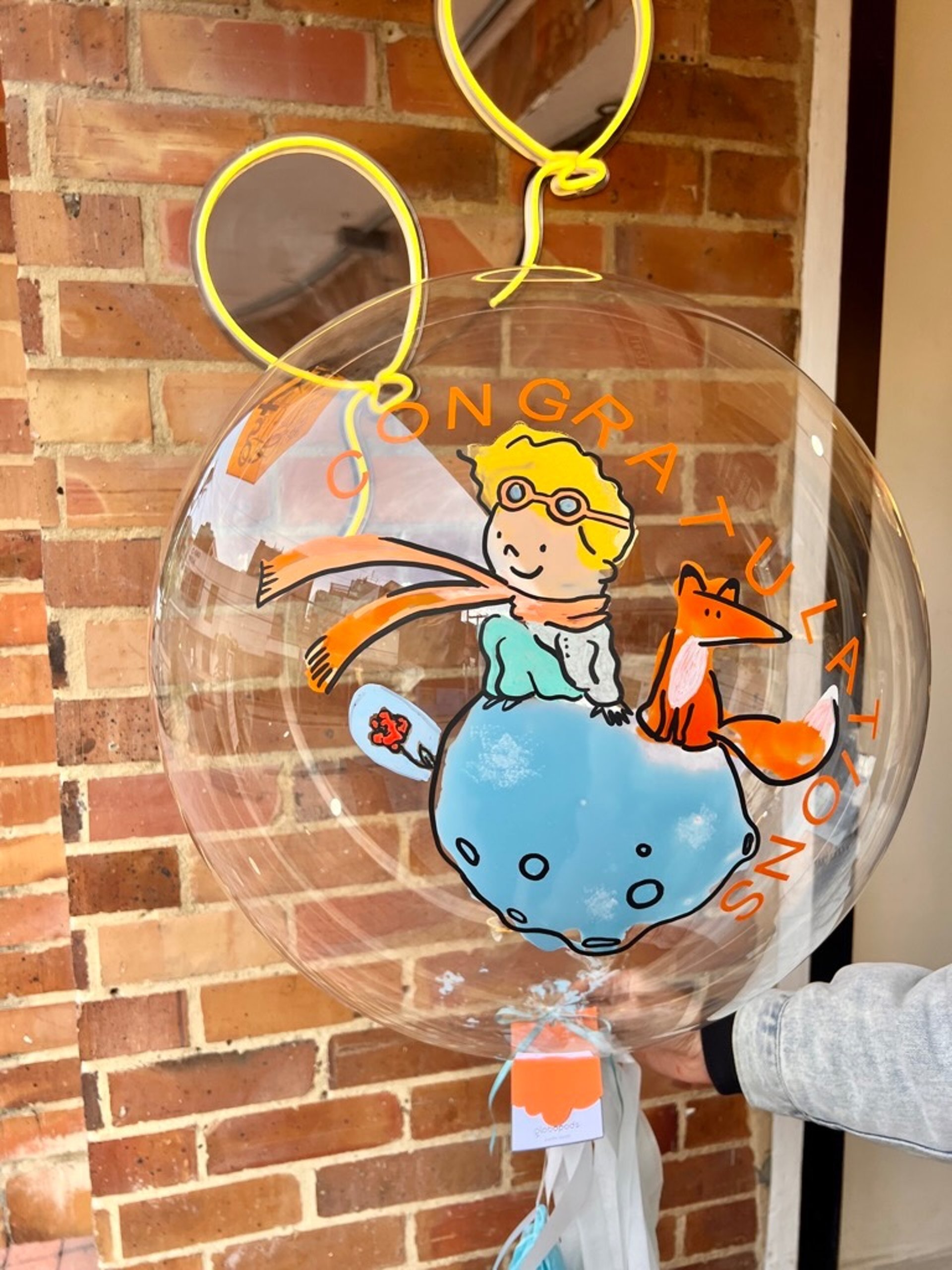 an abstract photo of a curved building with a blue sky in the background