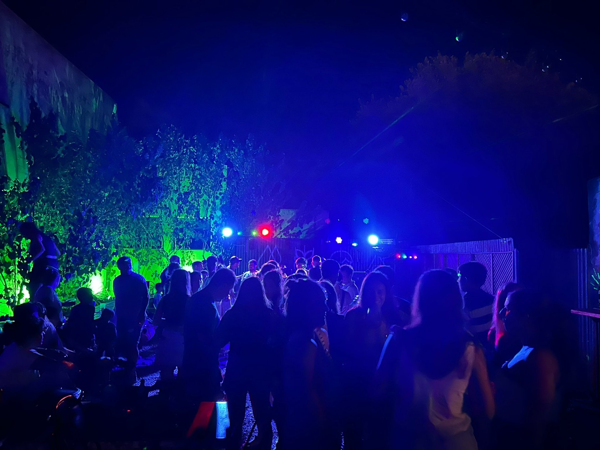 an abstract photo of a curved building with a blue sky in the background