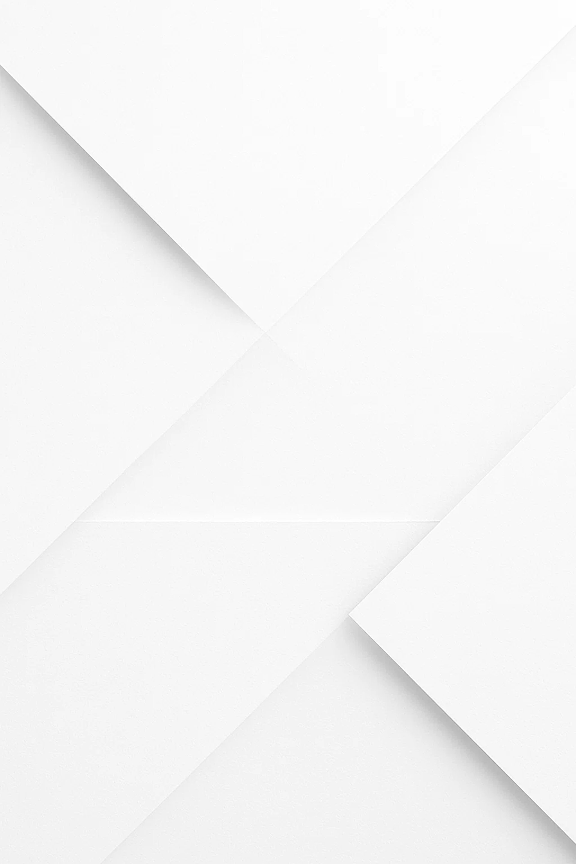 a close up of a white wall with peeling paint