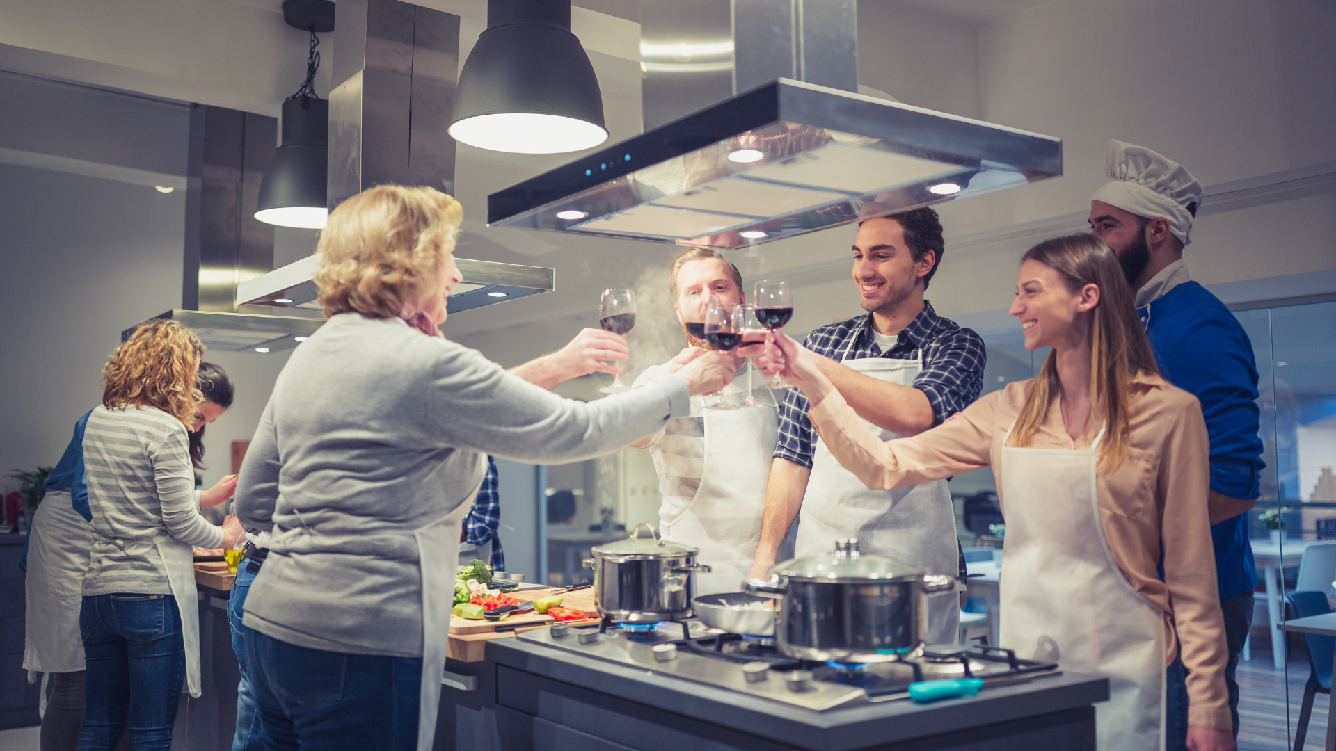 a group of people sitting on a bench in front of potted plants