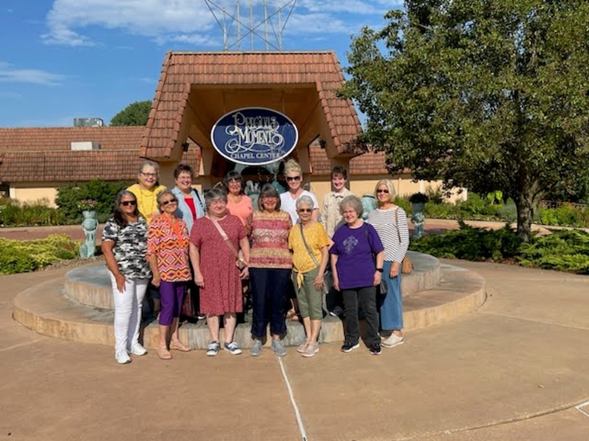 group of people sirring under sunset