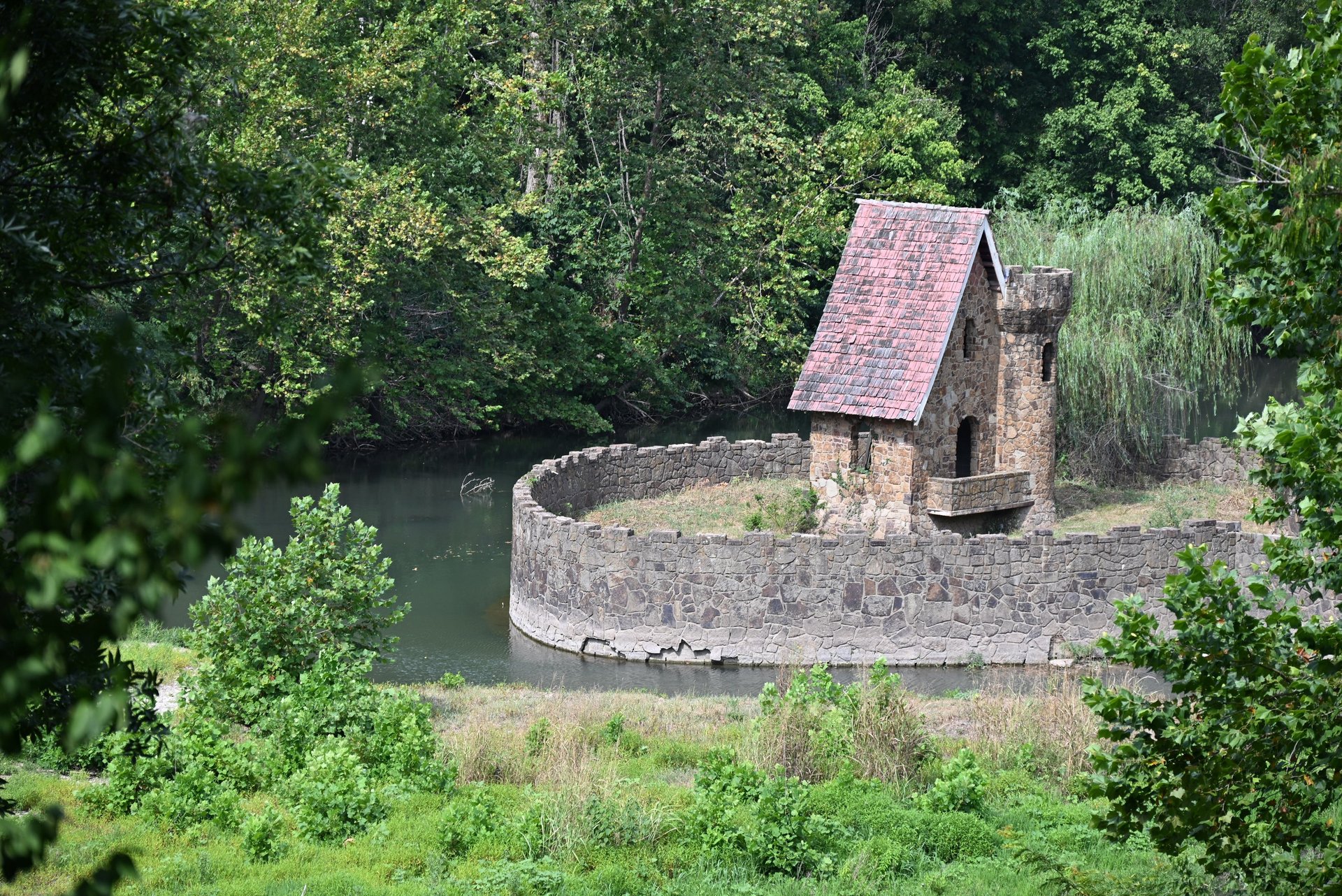 white concrete house surrounded by trees