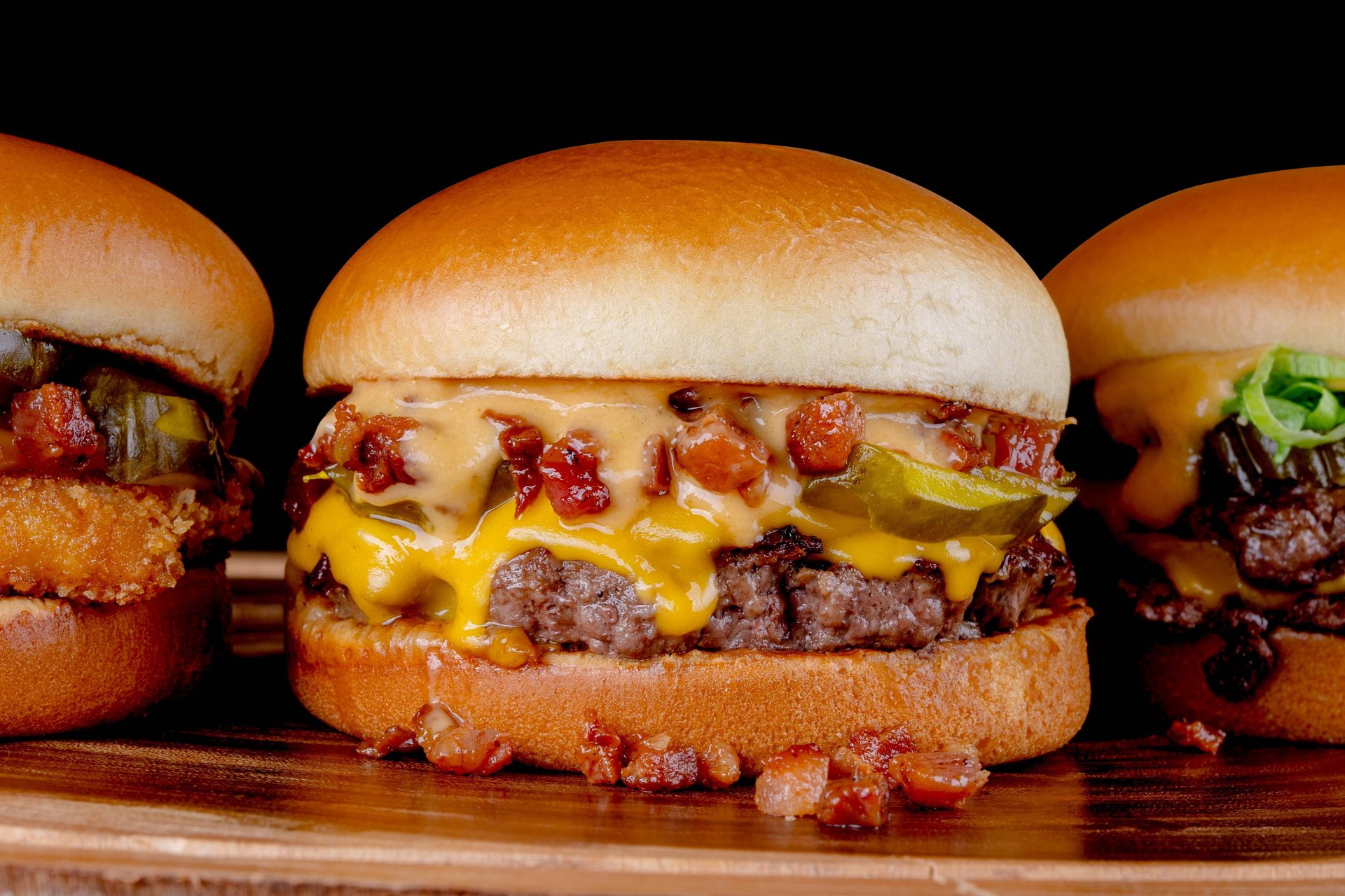 hamburger by french fries on board