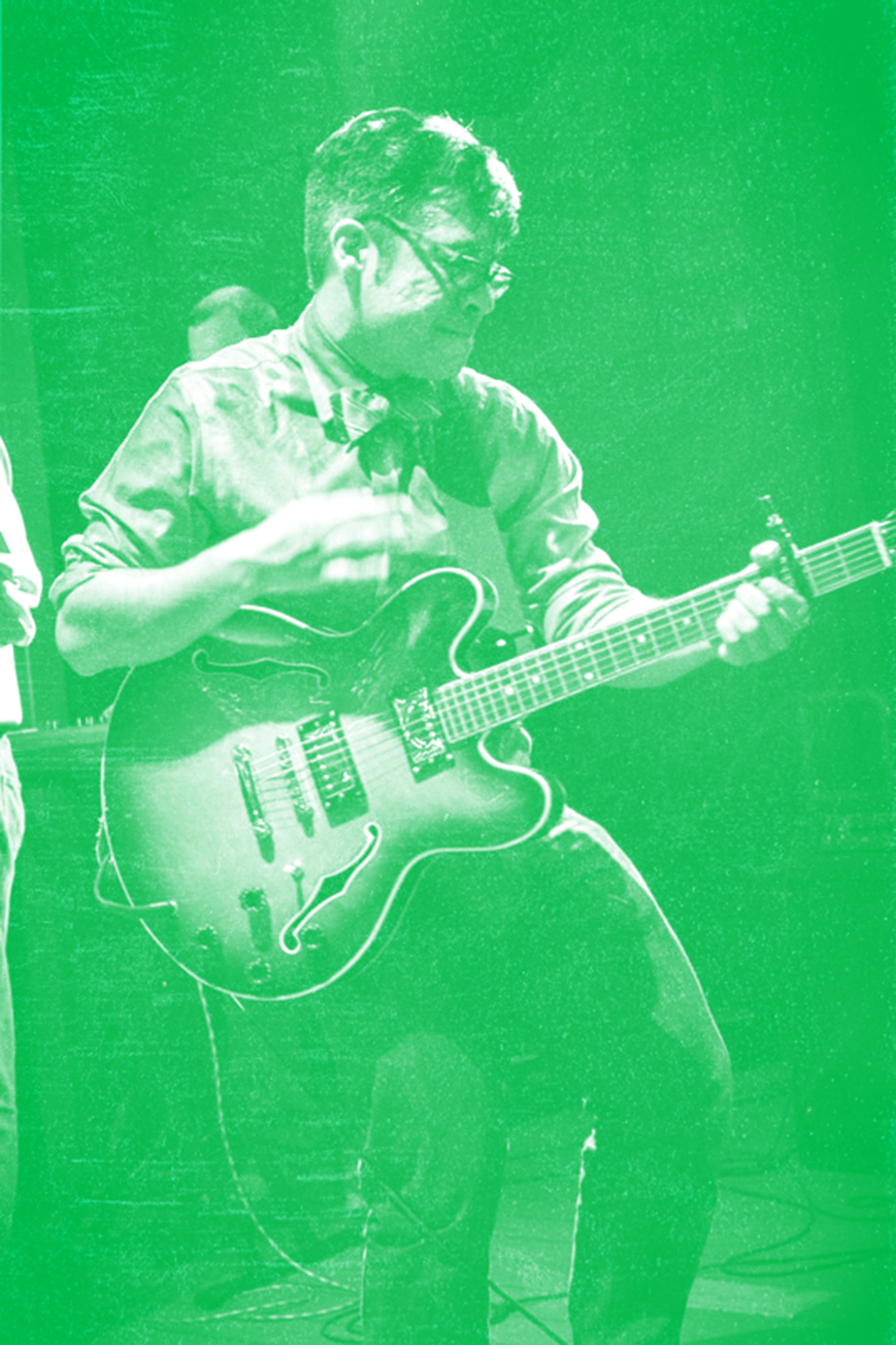 Antonio playing guitar at the Music Ranch in Austin, TX during a laid-back outdoor set