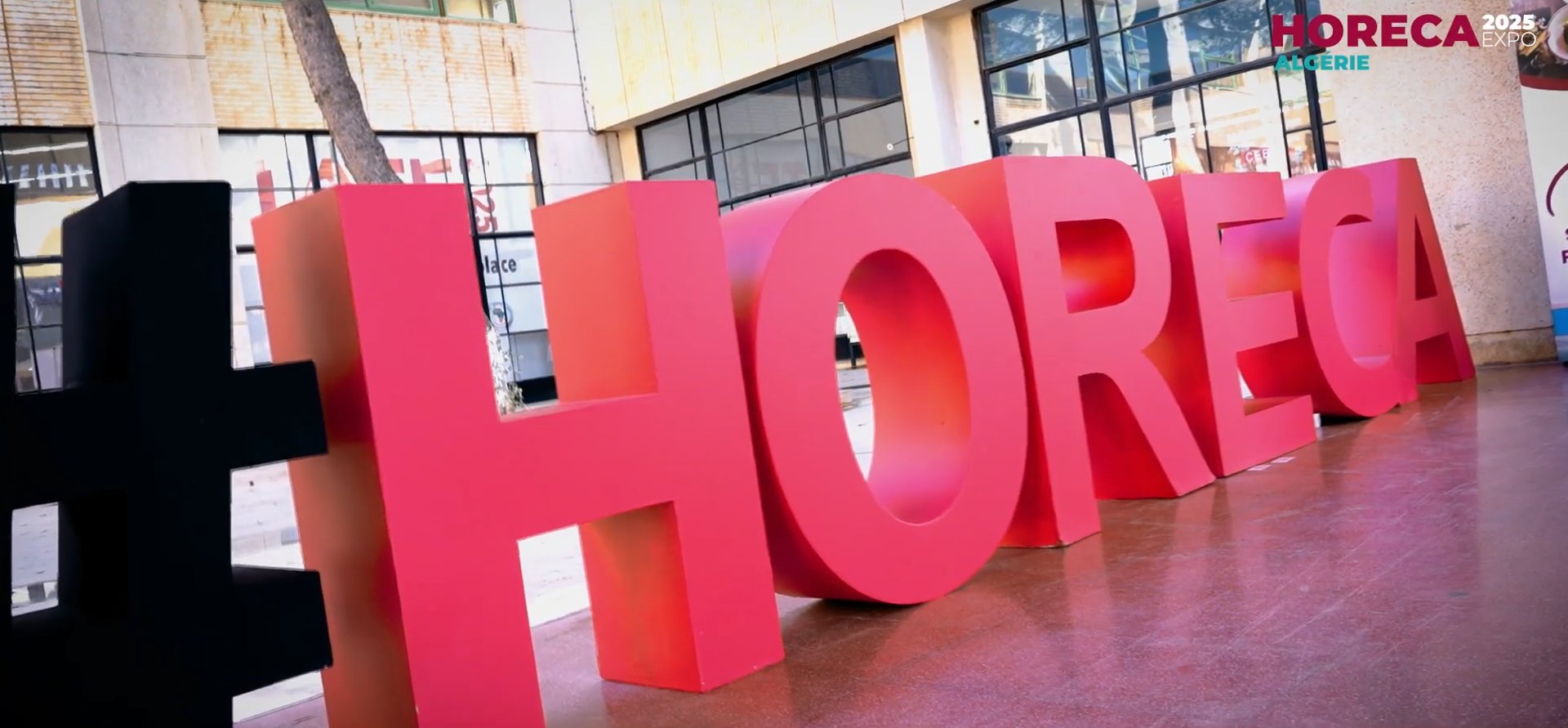 an abstract photo of a curved building with a blue sky in the background