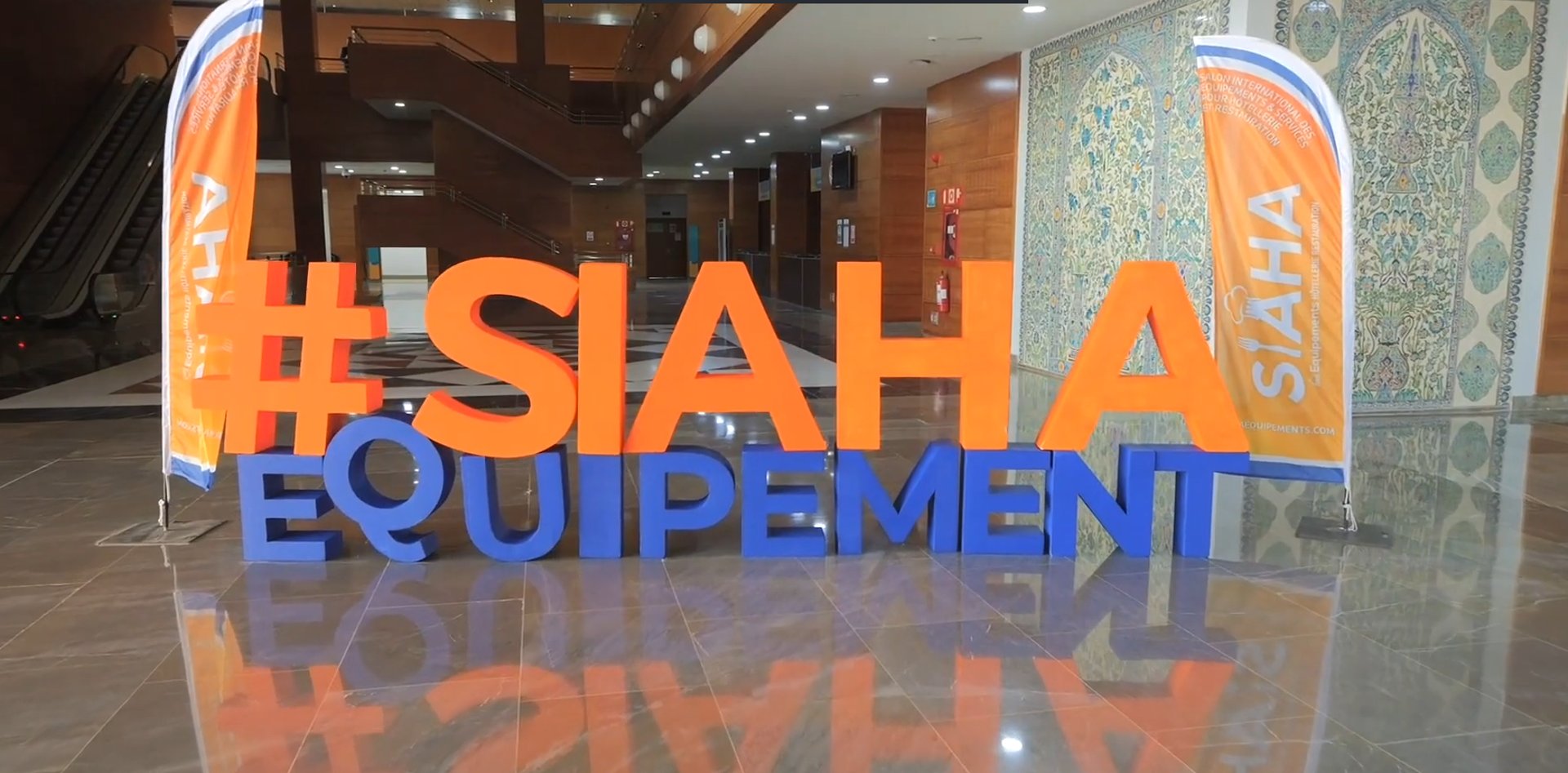 an abstract photo of a curved building with a blue sky in the background