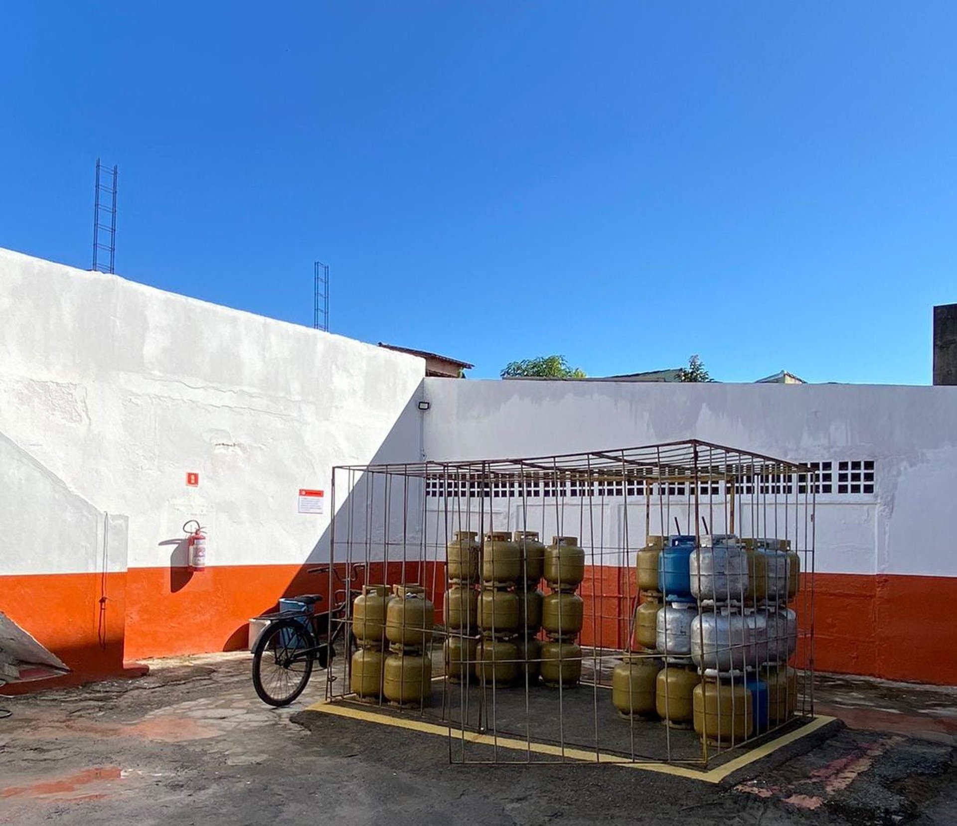 woman wearing yellow long-sleeved dress under white clouds and blue sky during daytime