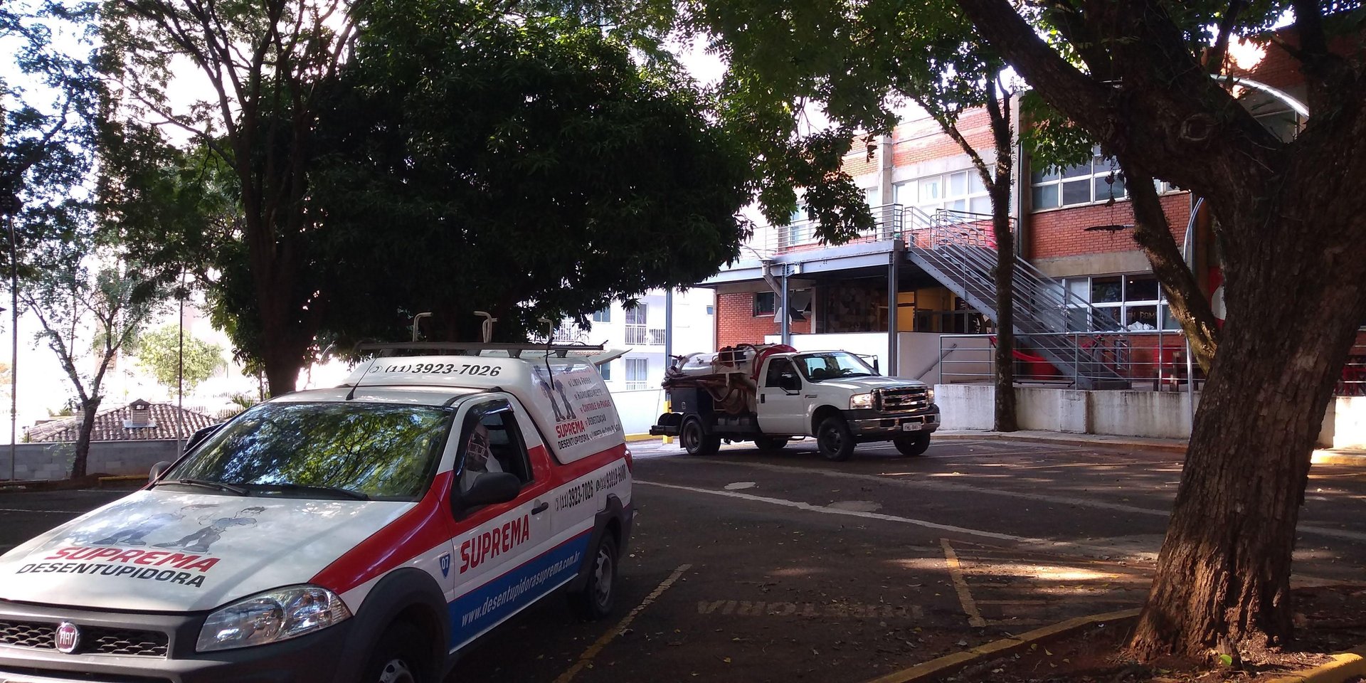 an abstract photo of a curved building with a blue sky in the background