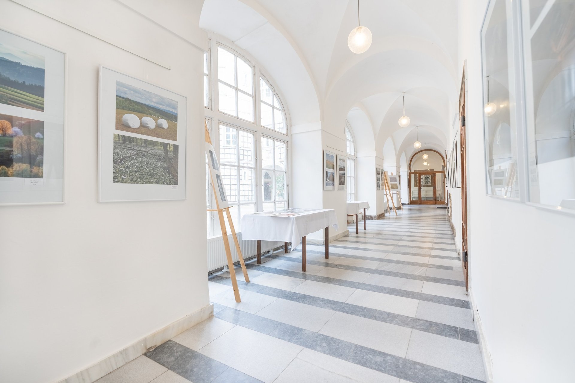 an abstract photo of a curved building with a blue sky in the background
