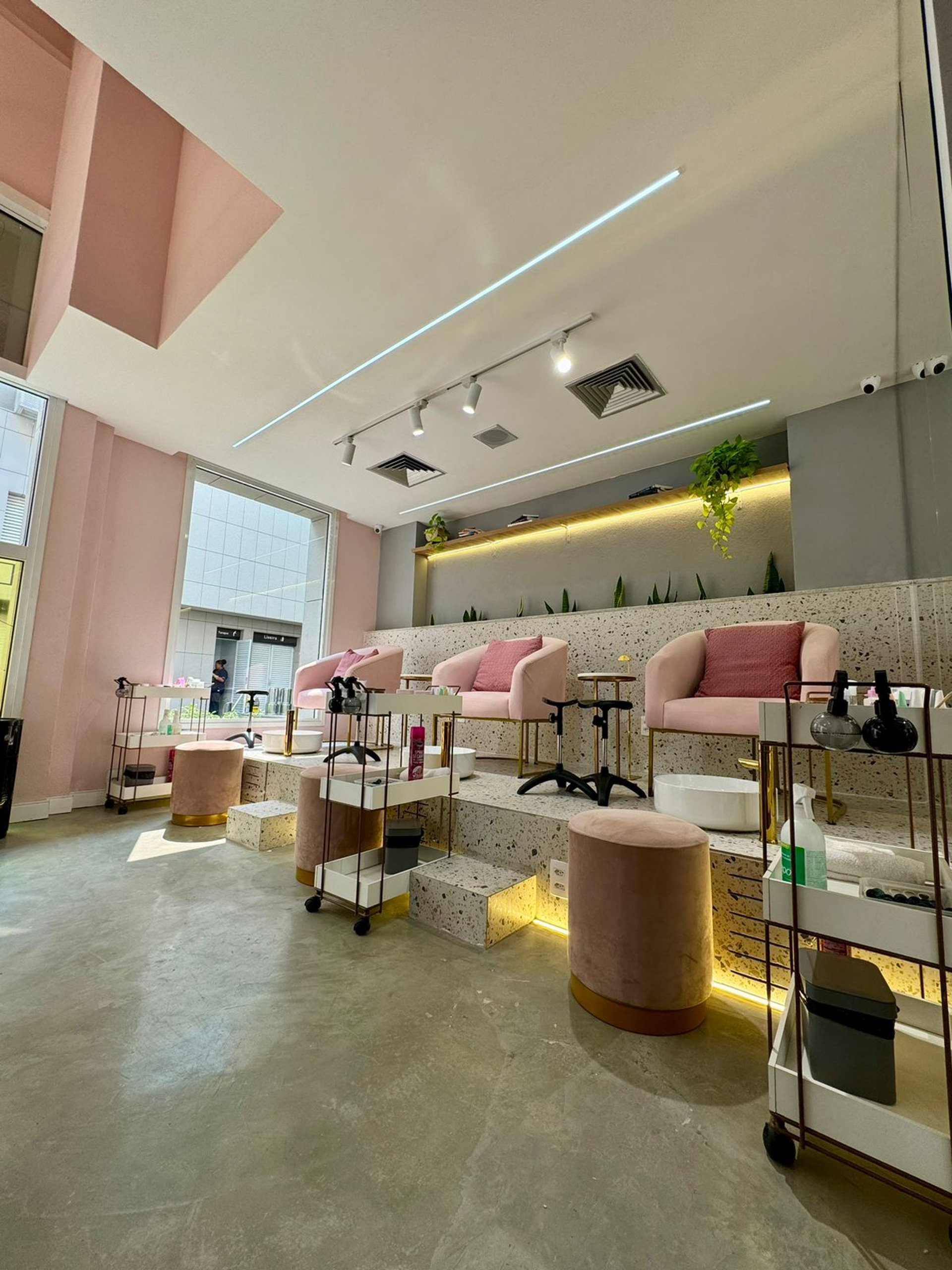 persons hand on pink surface