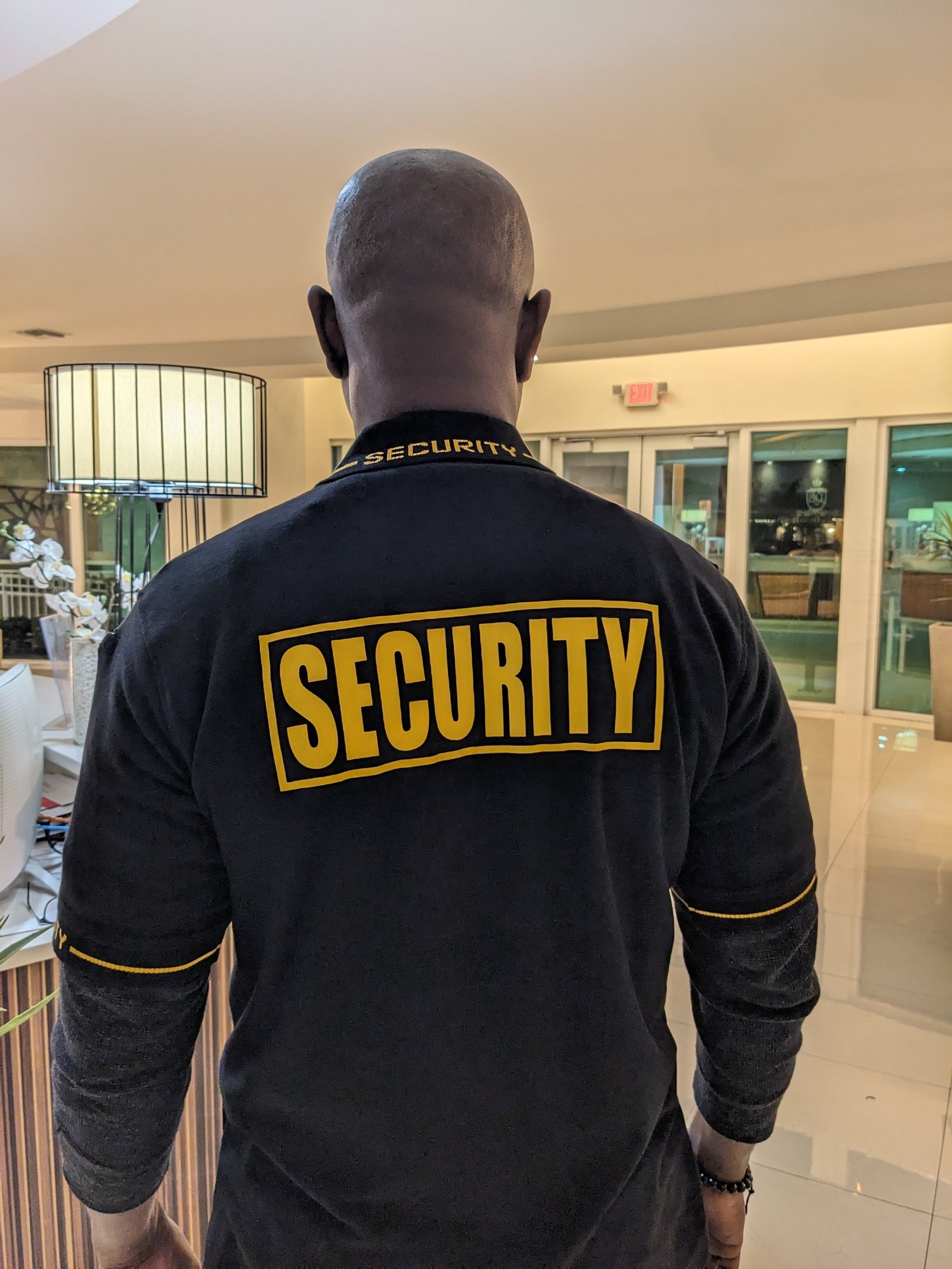 an abstract photo of a curved building with a blue sky in the background