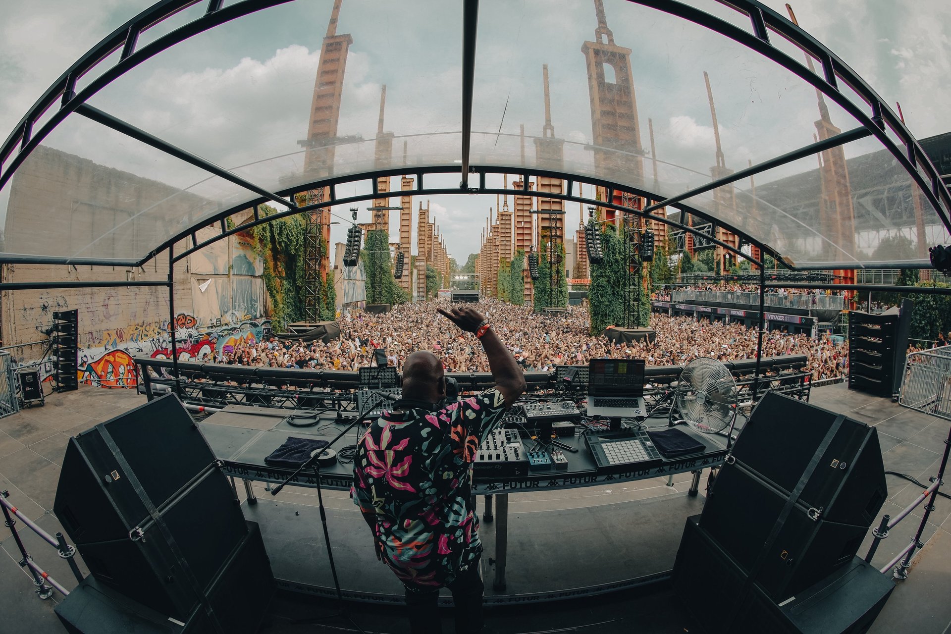 an abstract photo of a curved building with a blue sky in the background