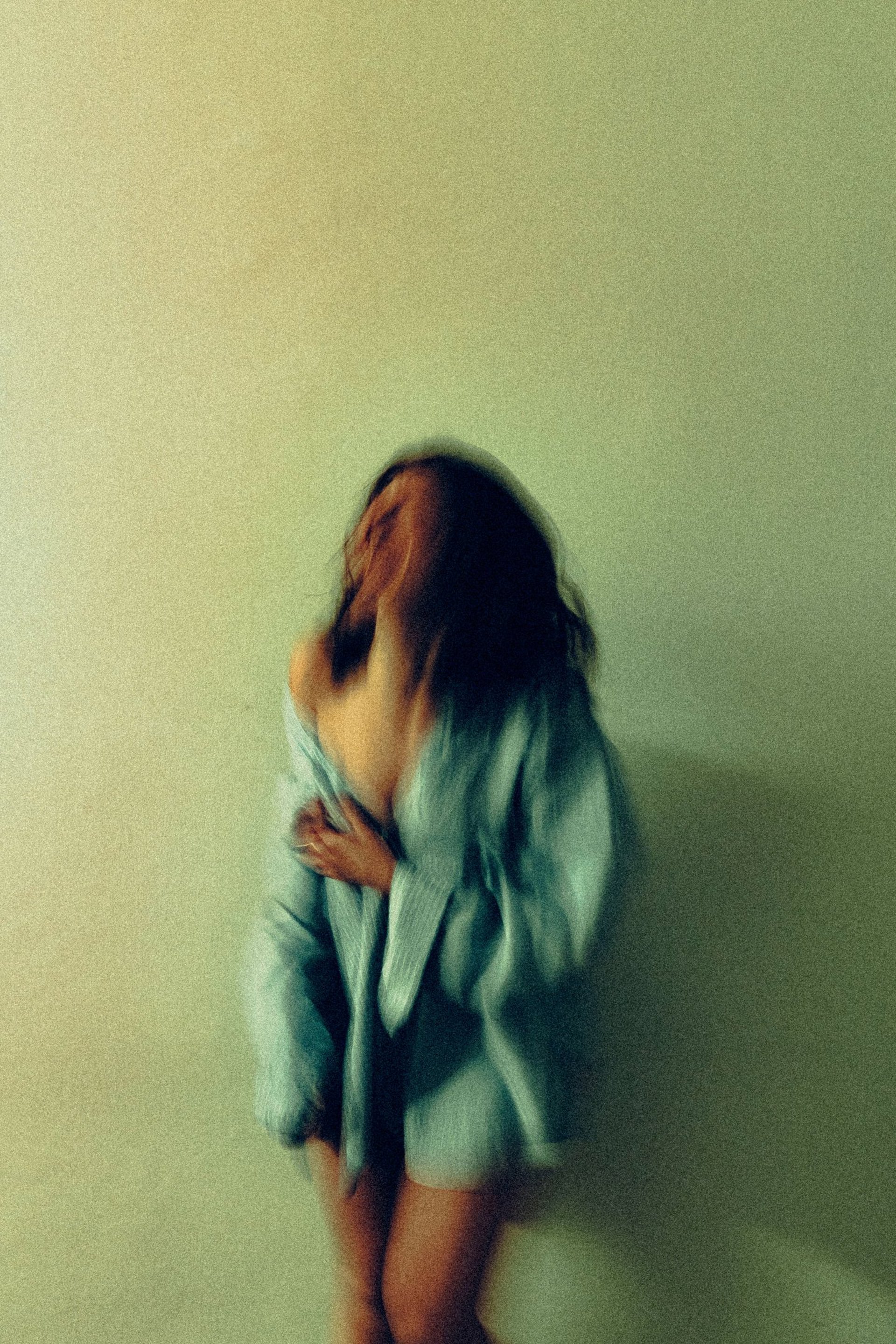 an abstract photo of a curved building with a blue sky in the background