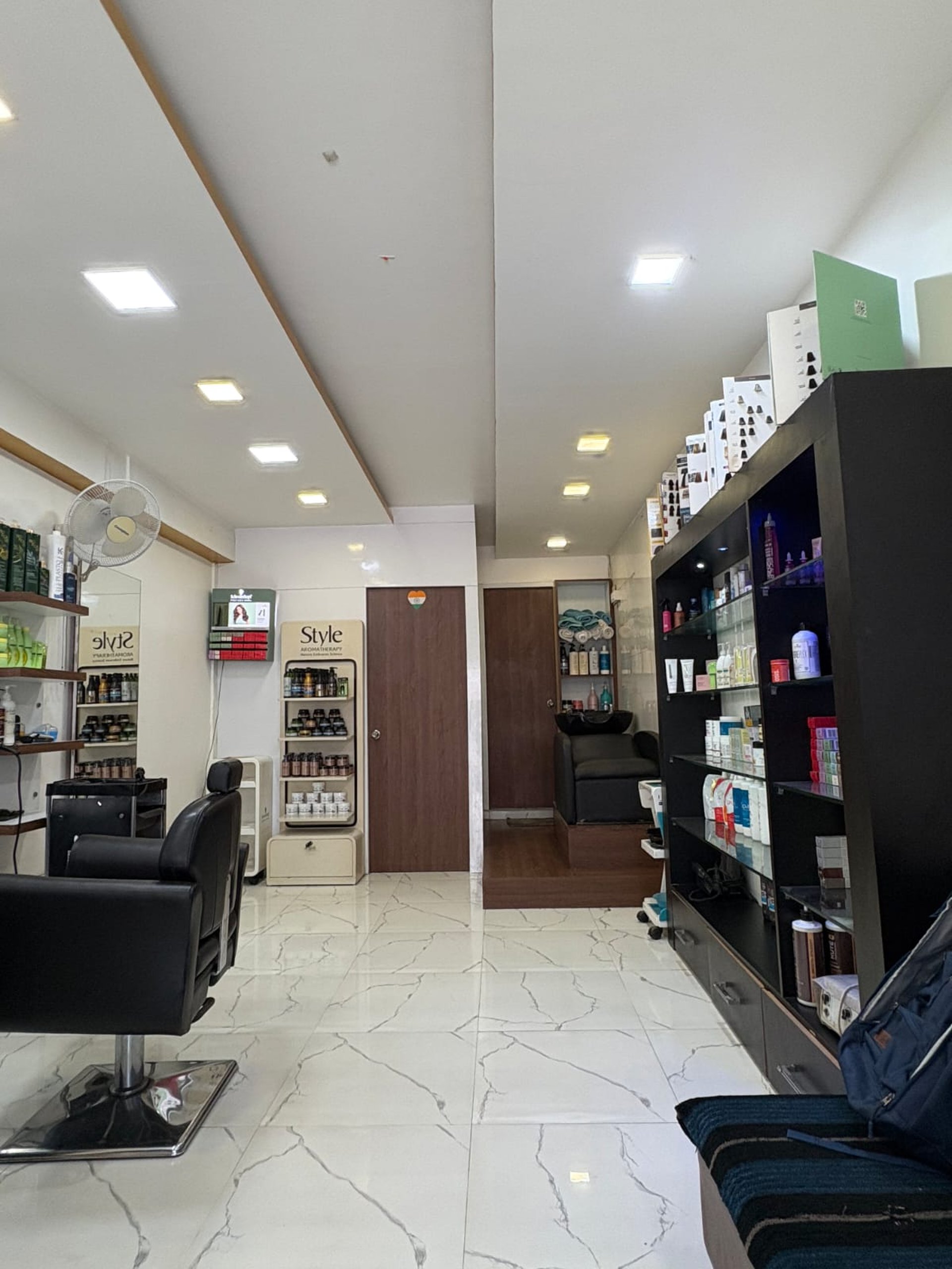 black and brown leather padded tub sofa