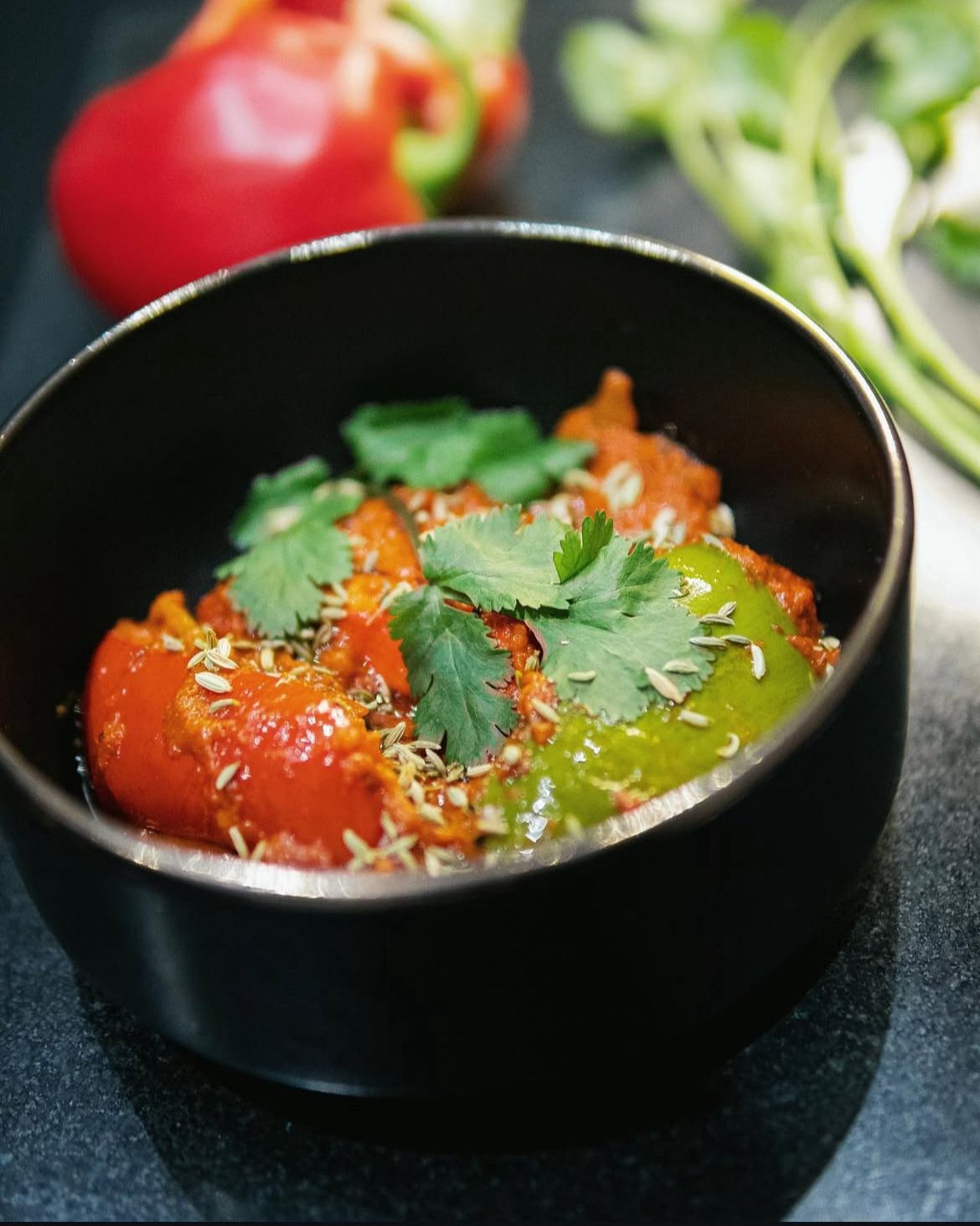 black ceramic bowl with soup