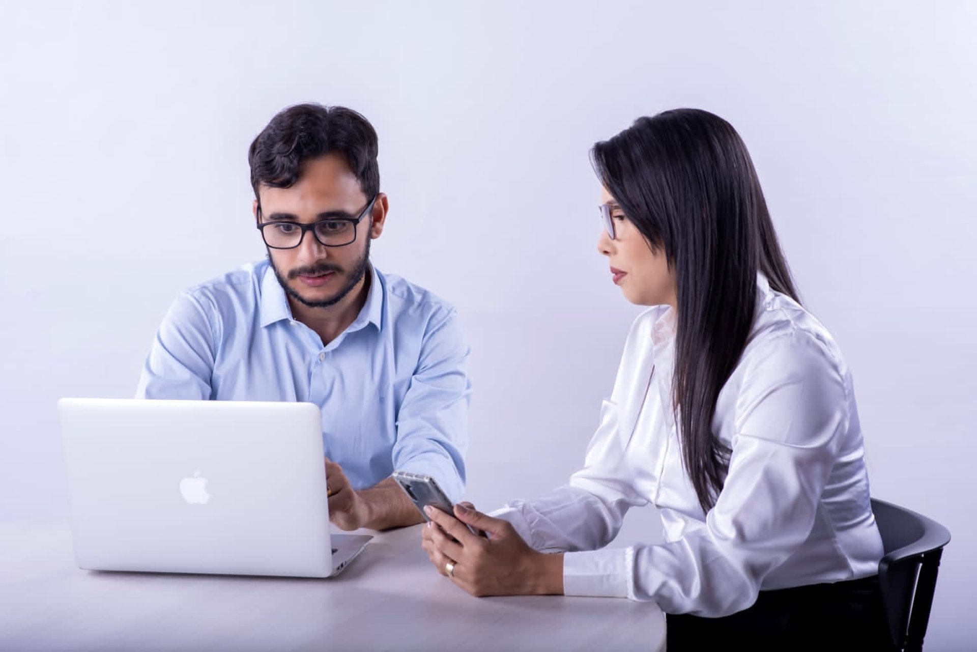 an abstract photo of a curved building with a blue sky in the background