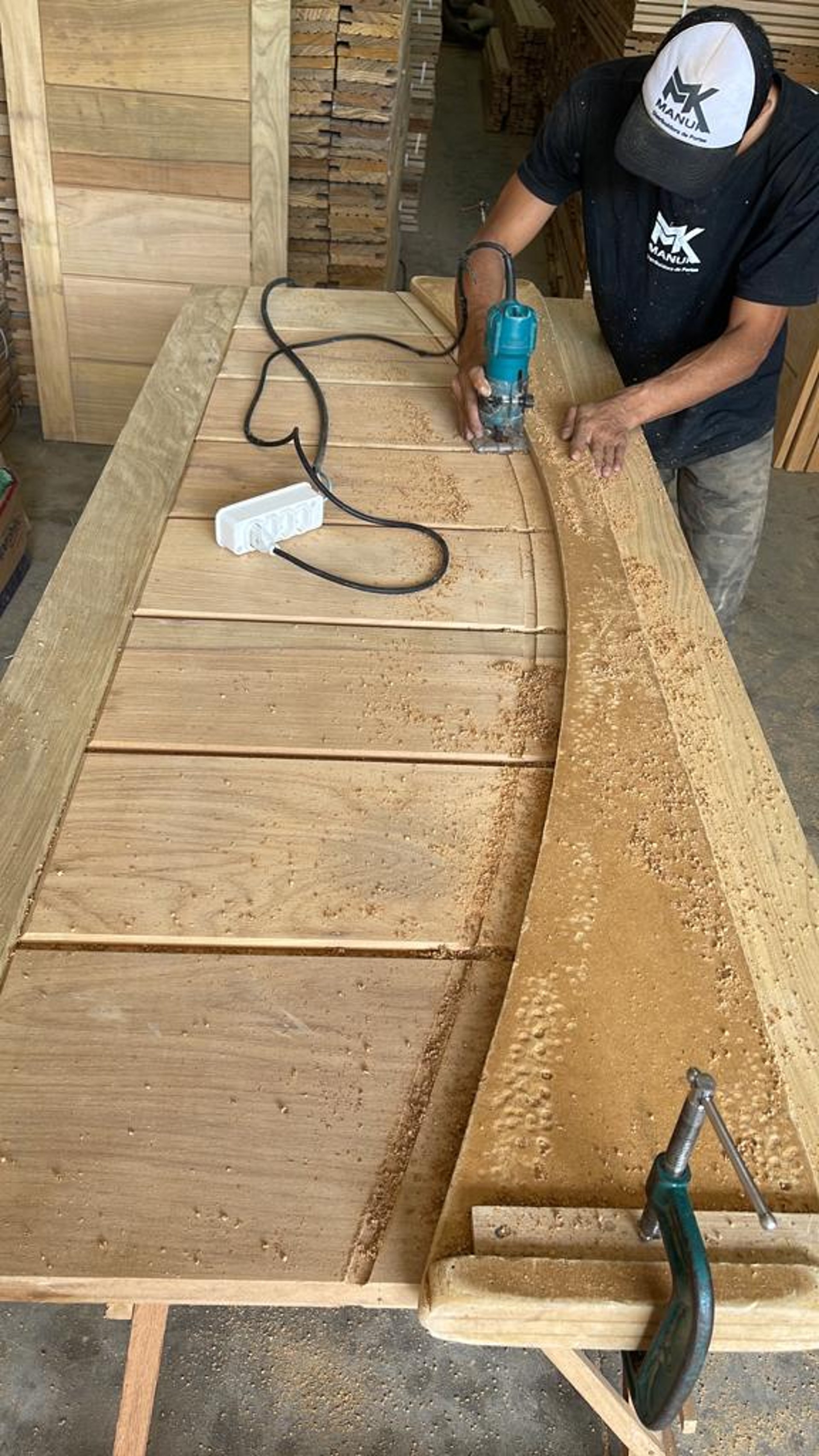 an abstract photo of a curved building with a blue sky in the background