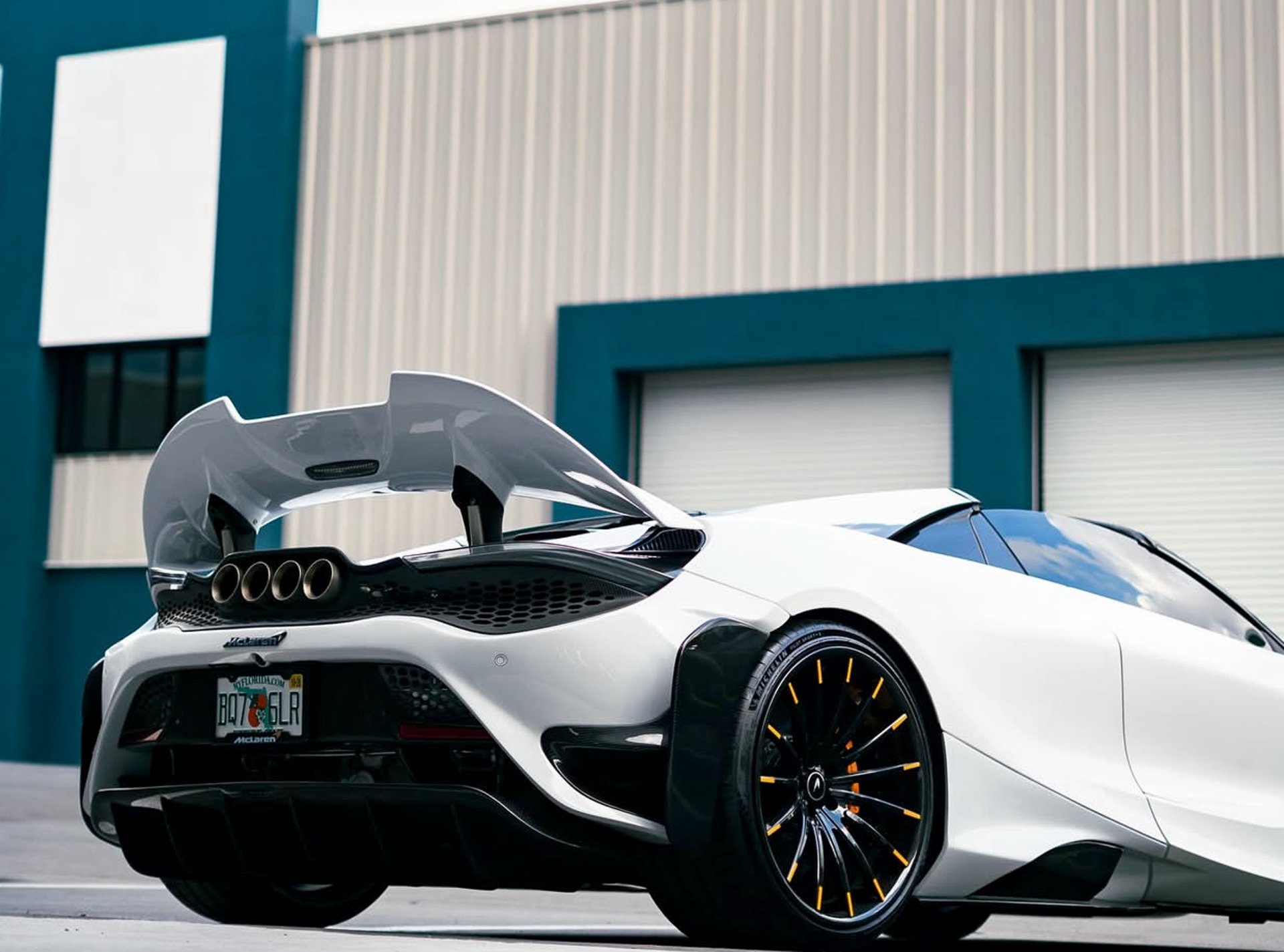 a close up of a white sports car tire