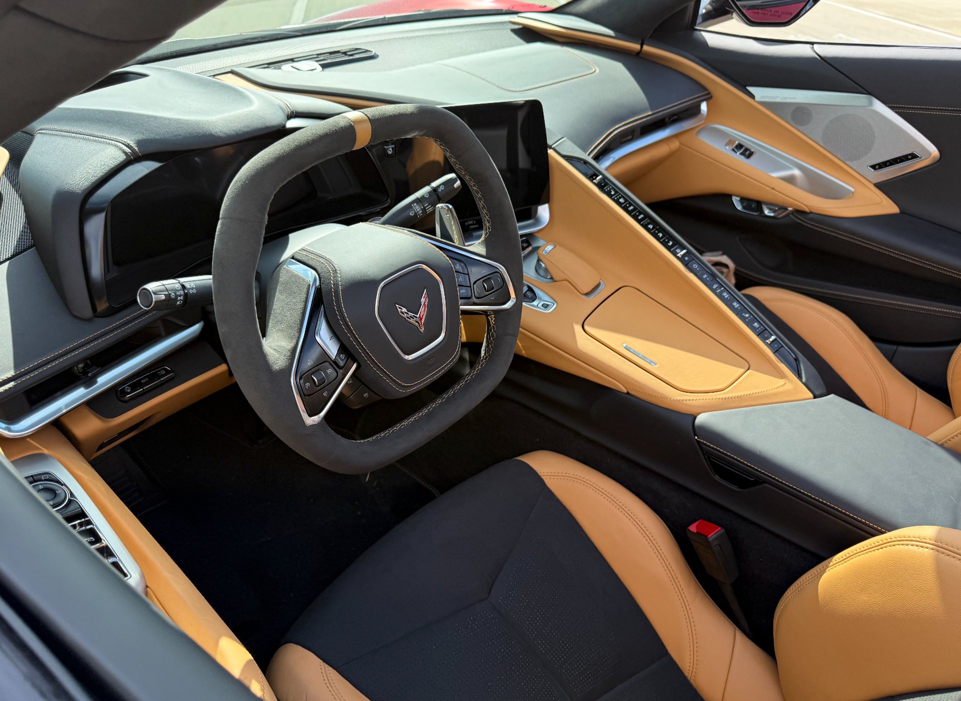 a blue sports car parked in a garage