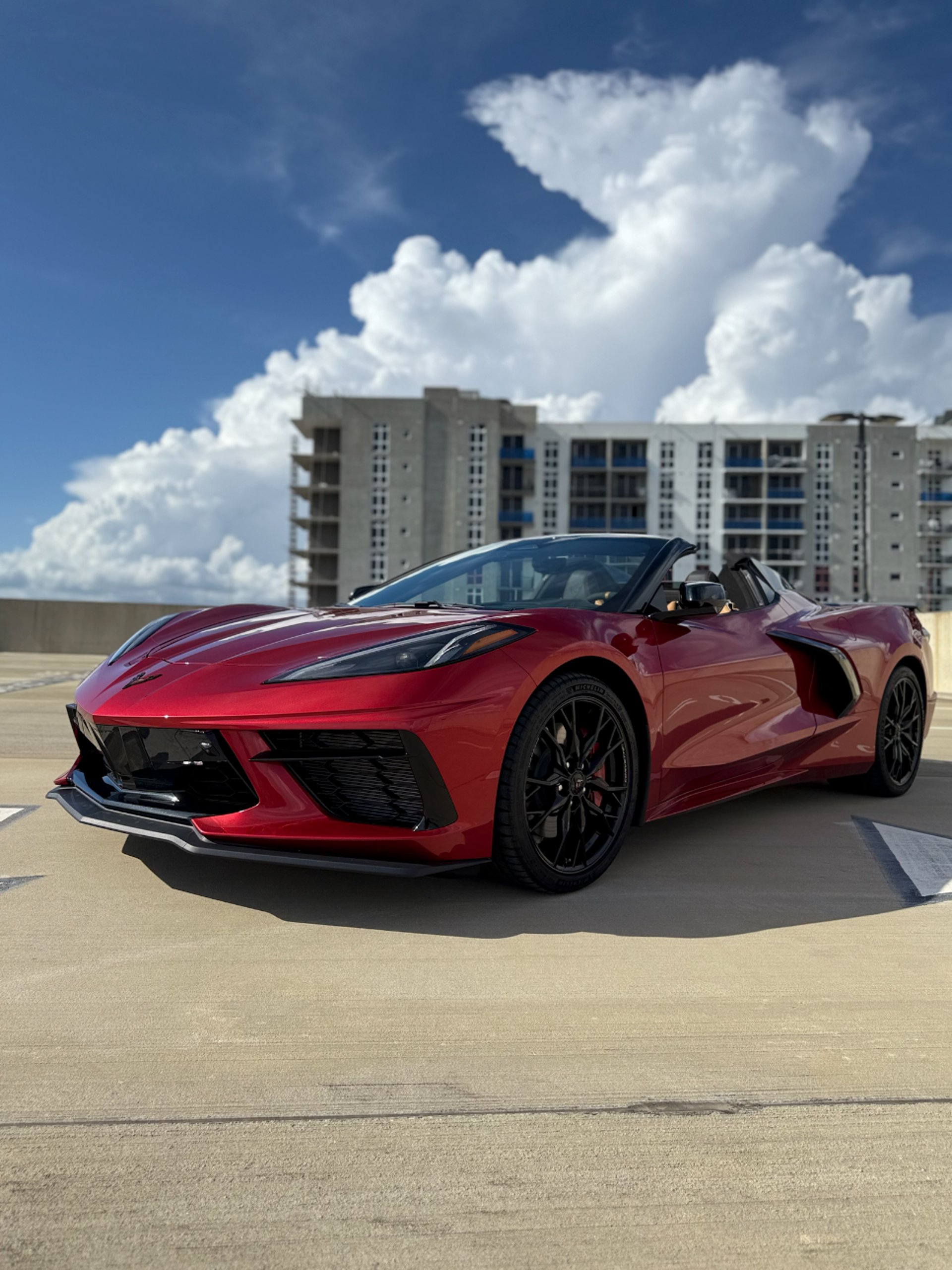 a red sports car parked in a garage