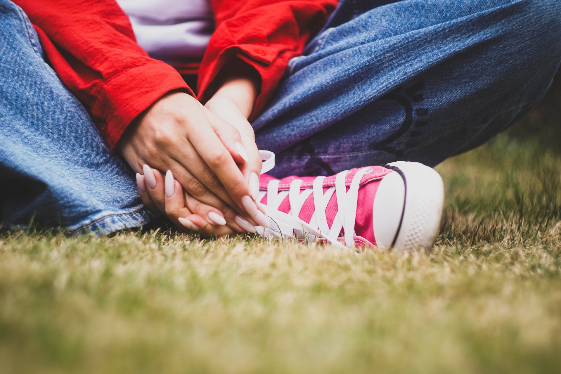 woman wearing yellow long-sleeved dress under white clouds and blue sky during daytime