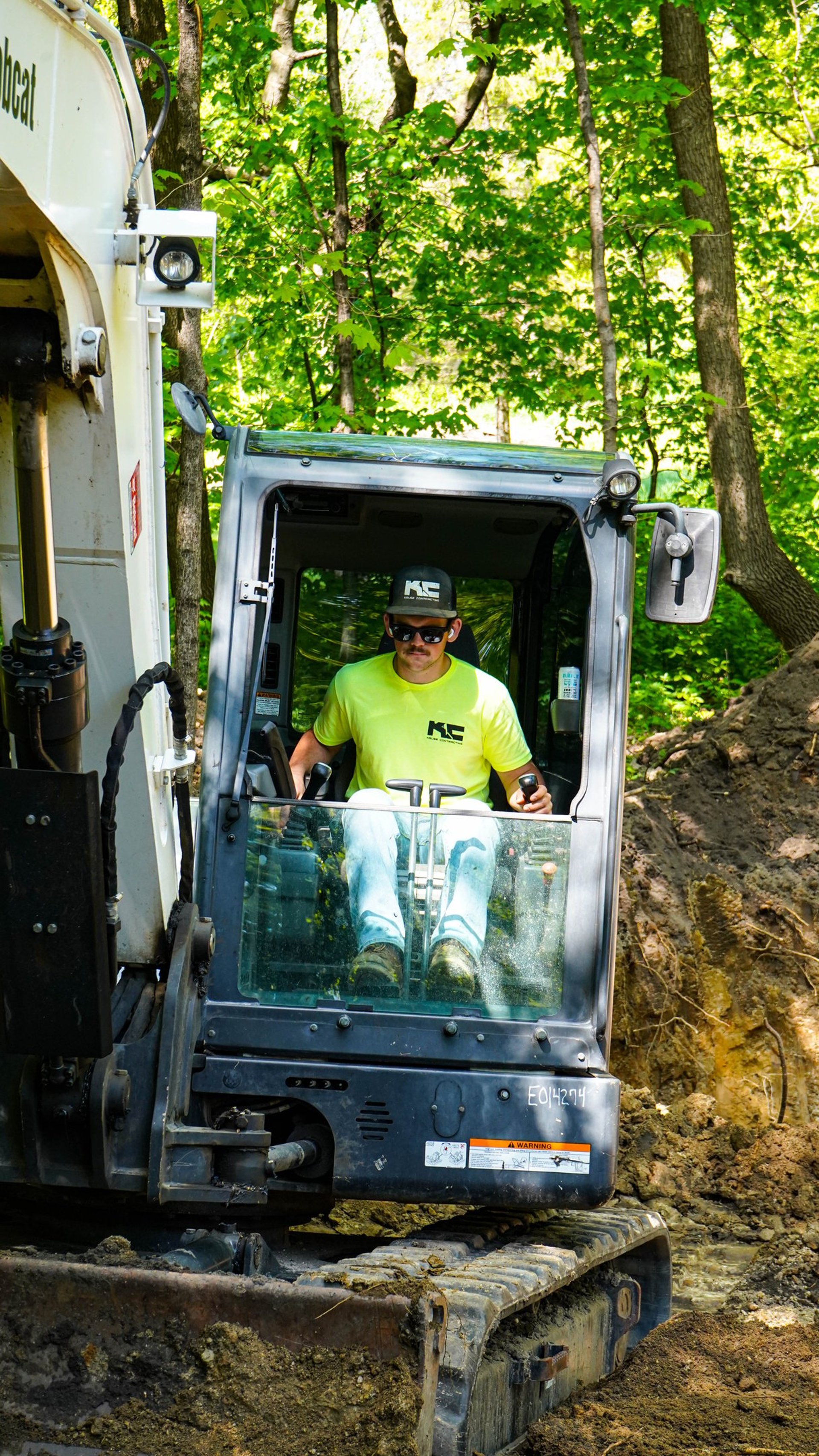 Patrick Kruse, Owner of Kruse Contracting, digging in an excavator