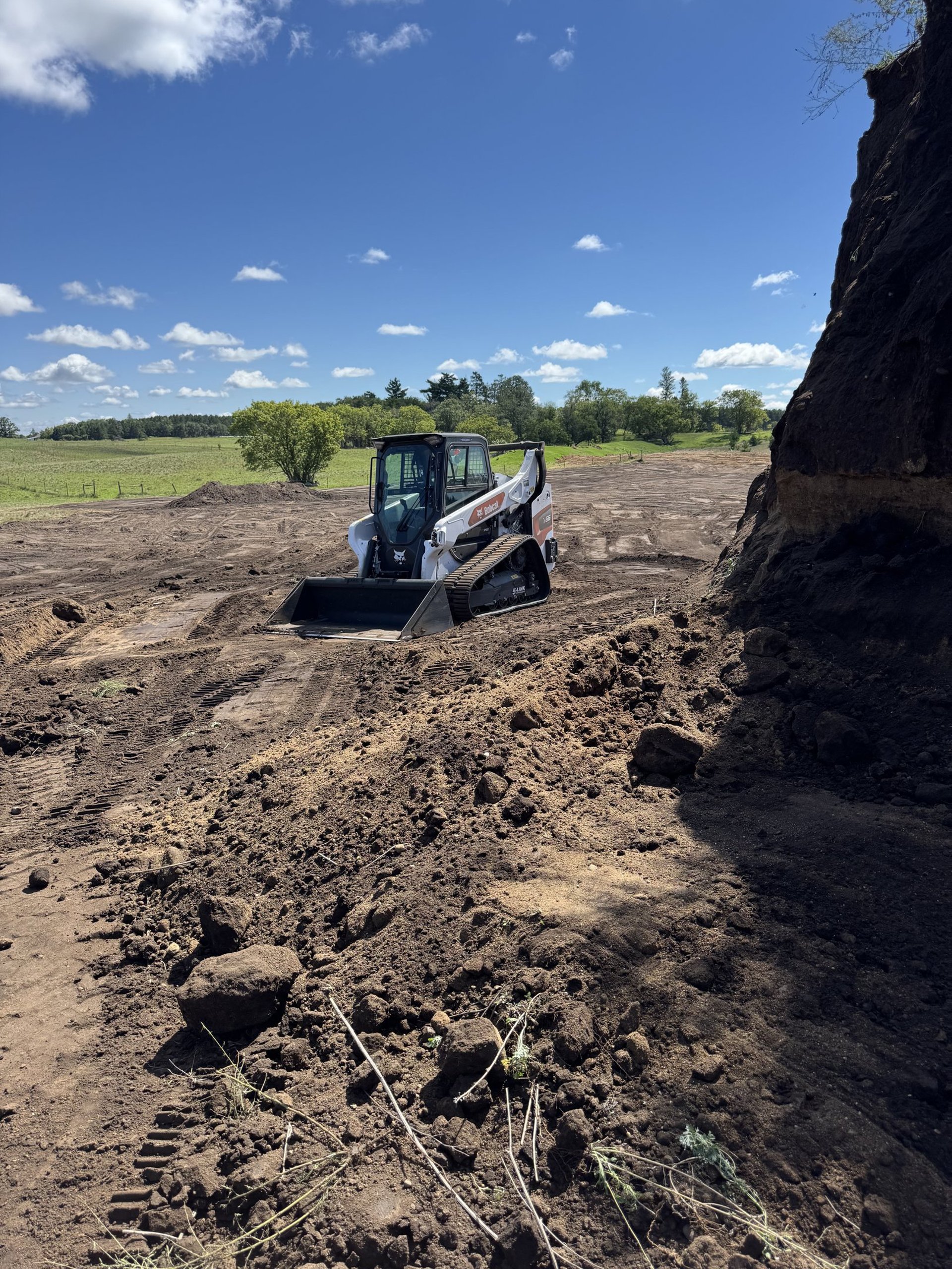 skid-steer-moving-dirt.jpg