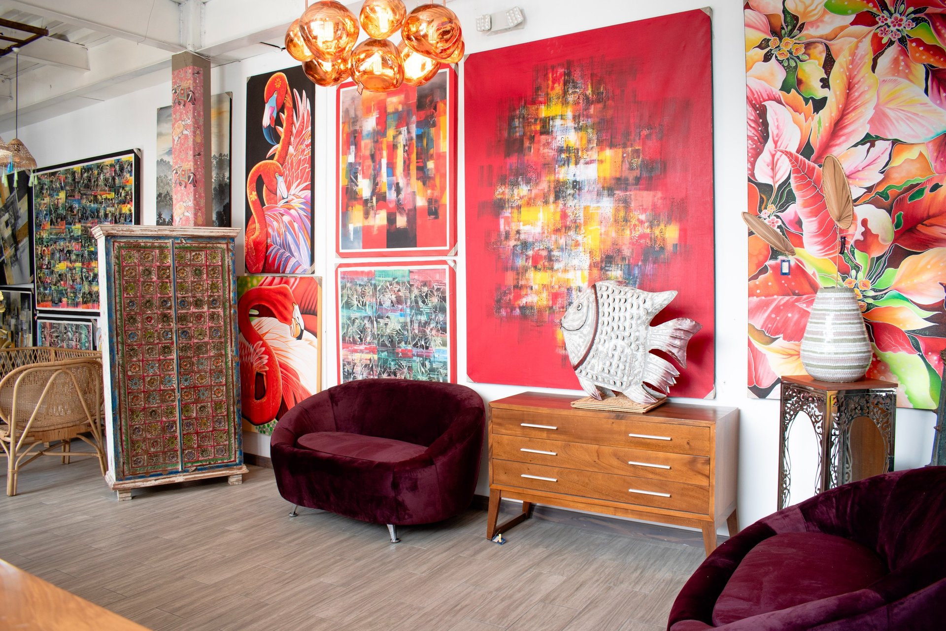 a living room filled with furniture and a wooden floor