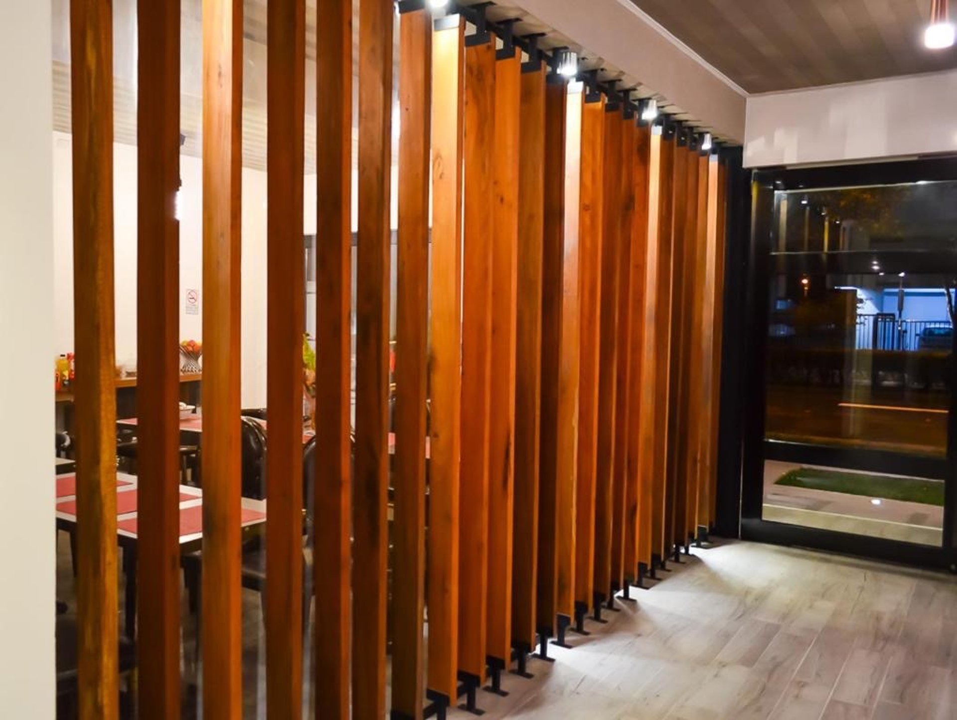 a bar sign sitting on top of a wooden table