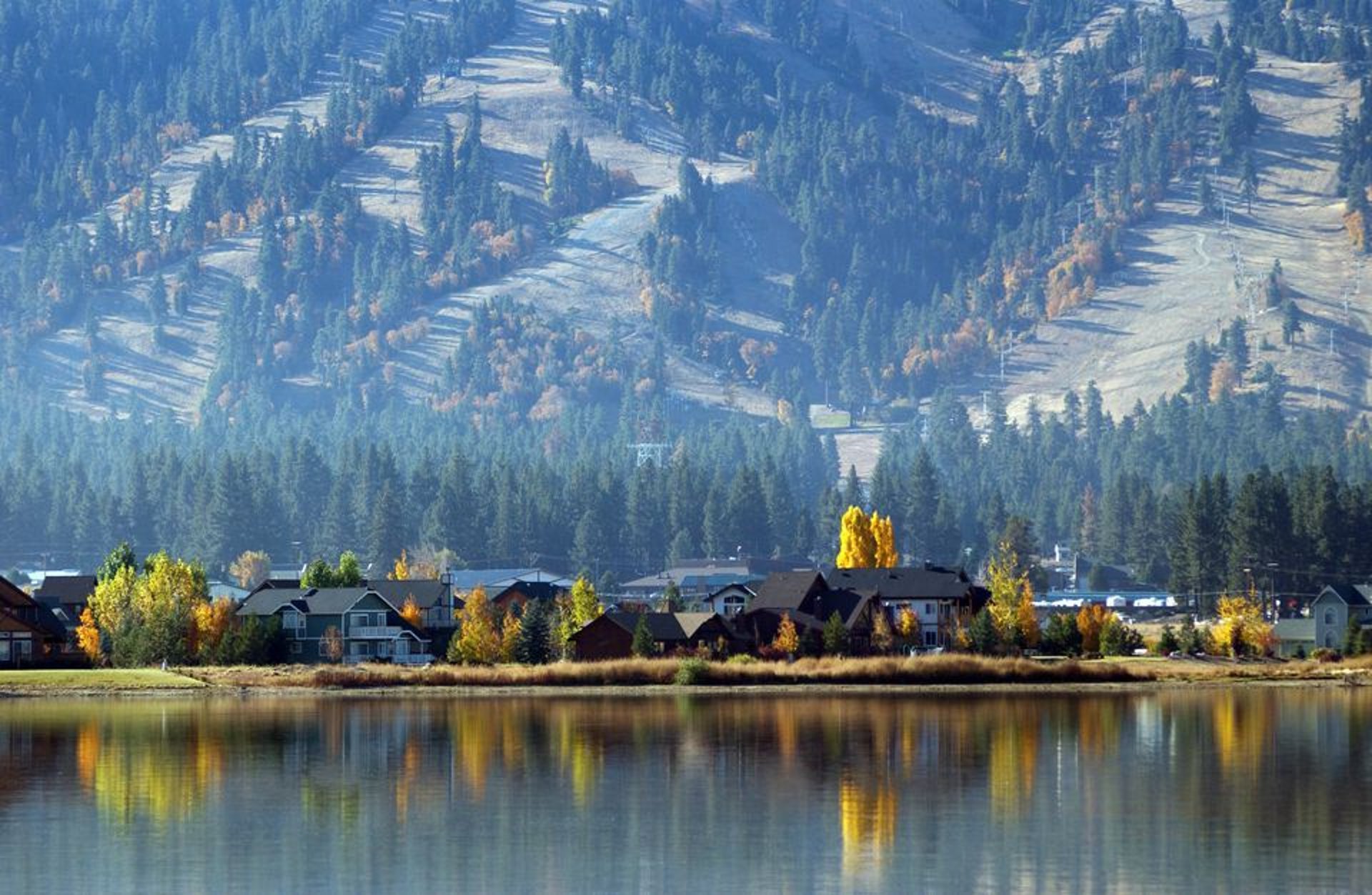 woman wearing yellow long-sleeved dress under white clouds and blue sky during daytime