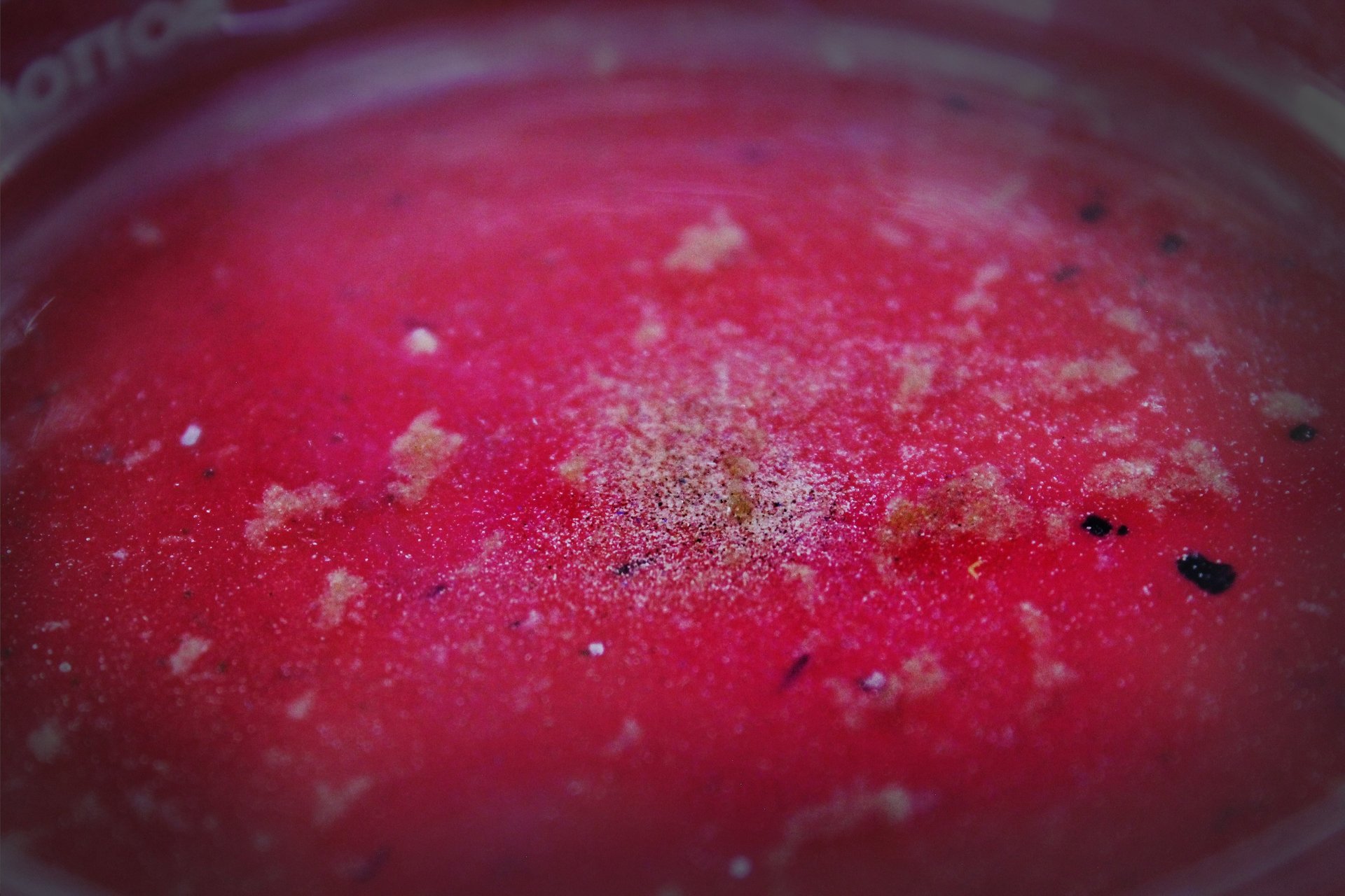 an abstract photo of a curved building with a blue sky in the background