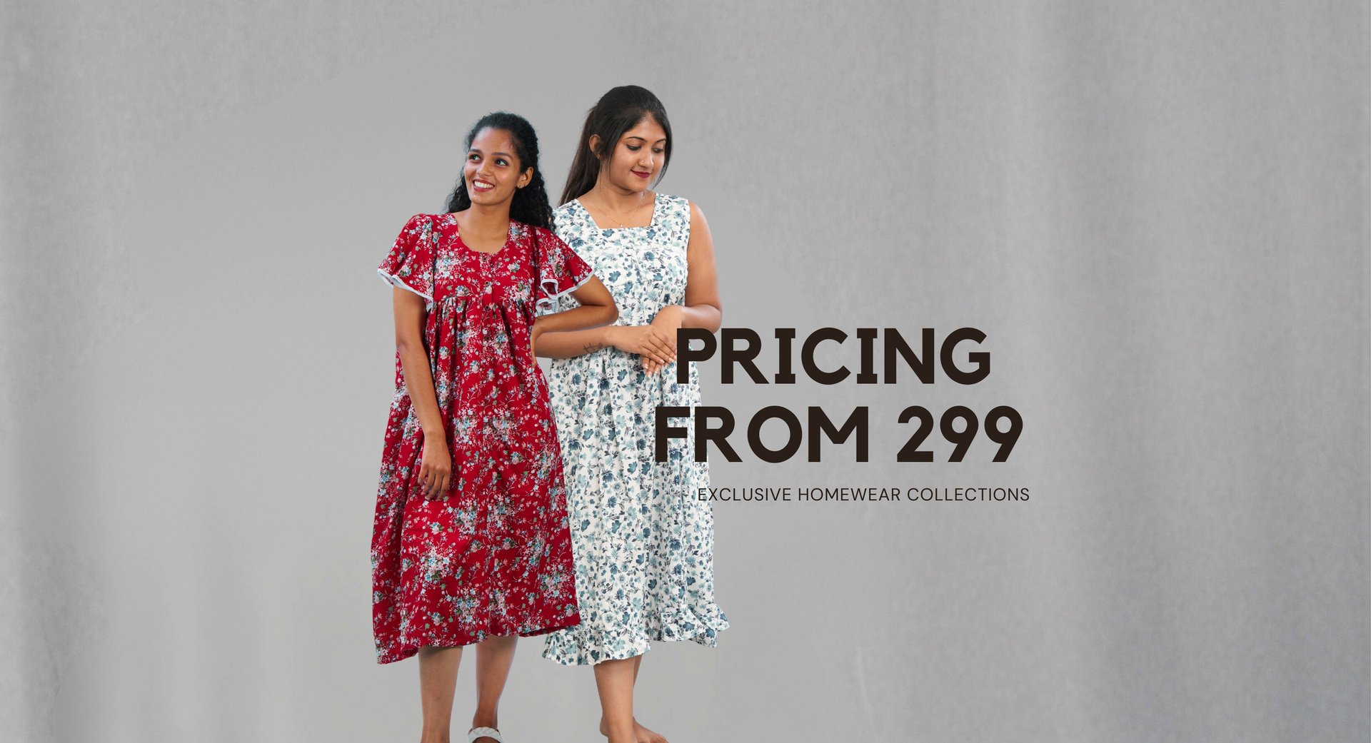 White clothing hangs on a clothing rack.