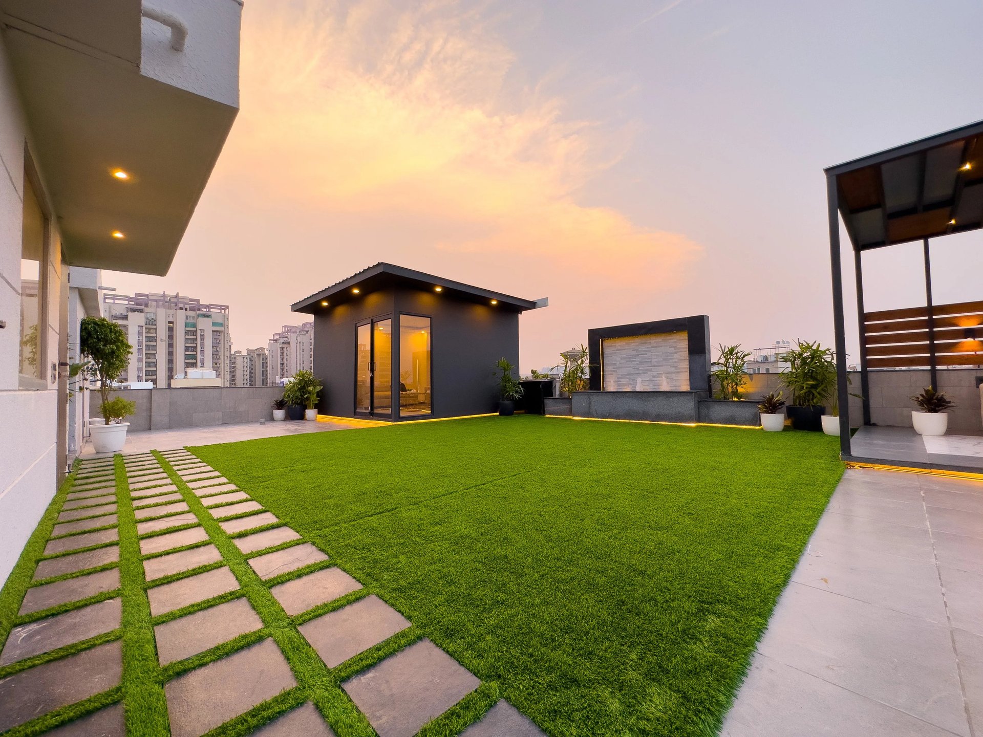 Beautiful terrace garden with pergola and hanging plants