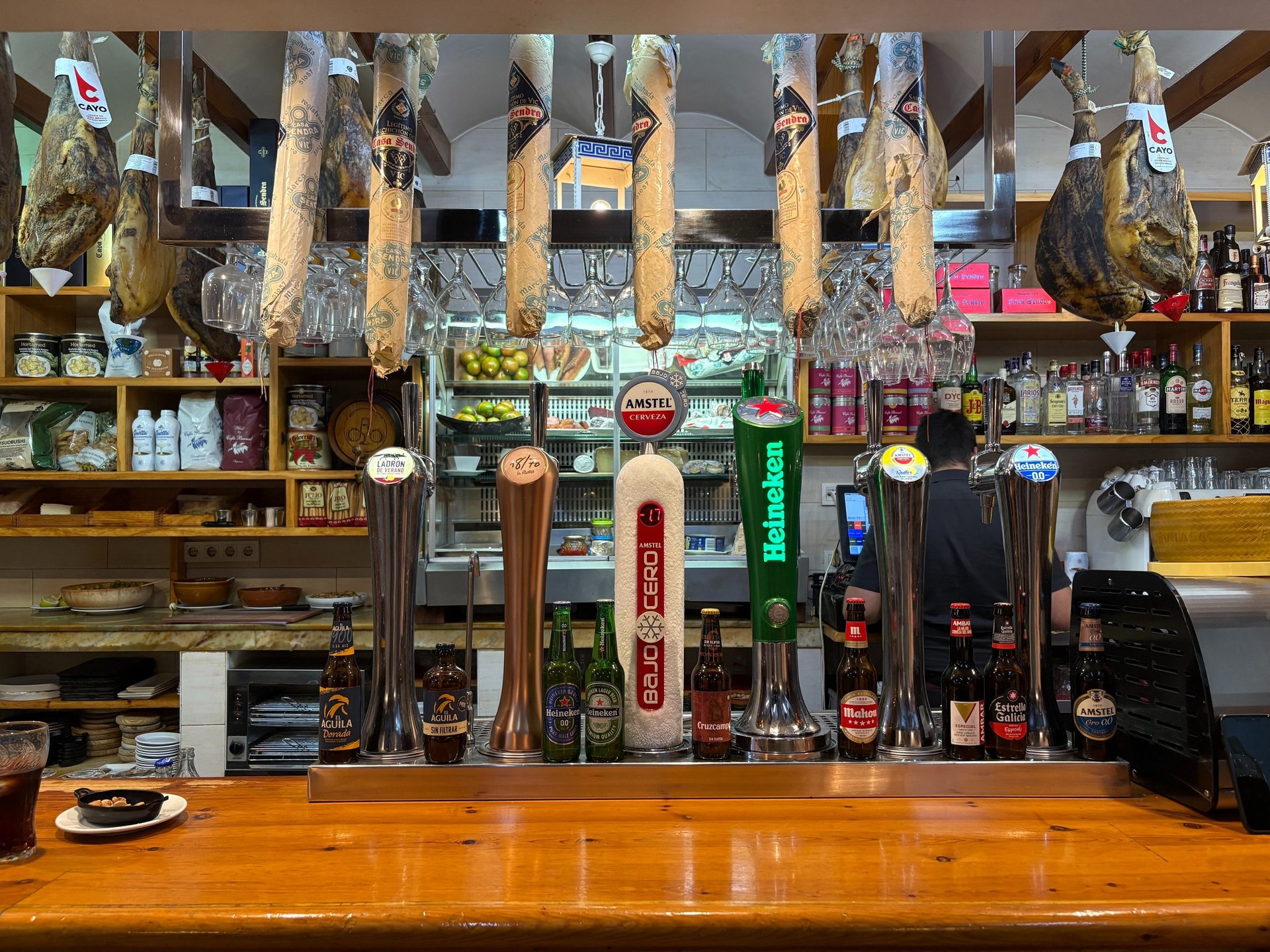 an abstract photo of a curved building with a blue sky in the background