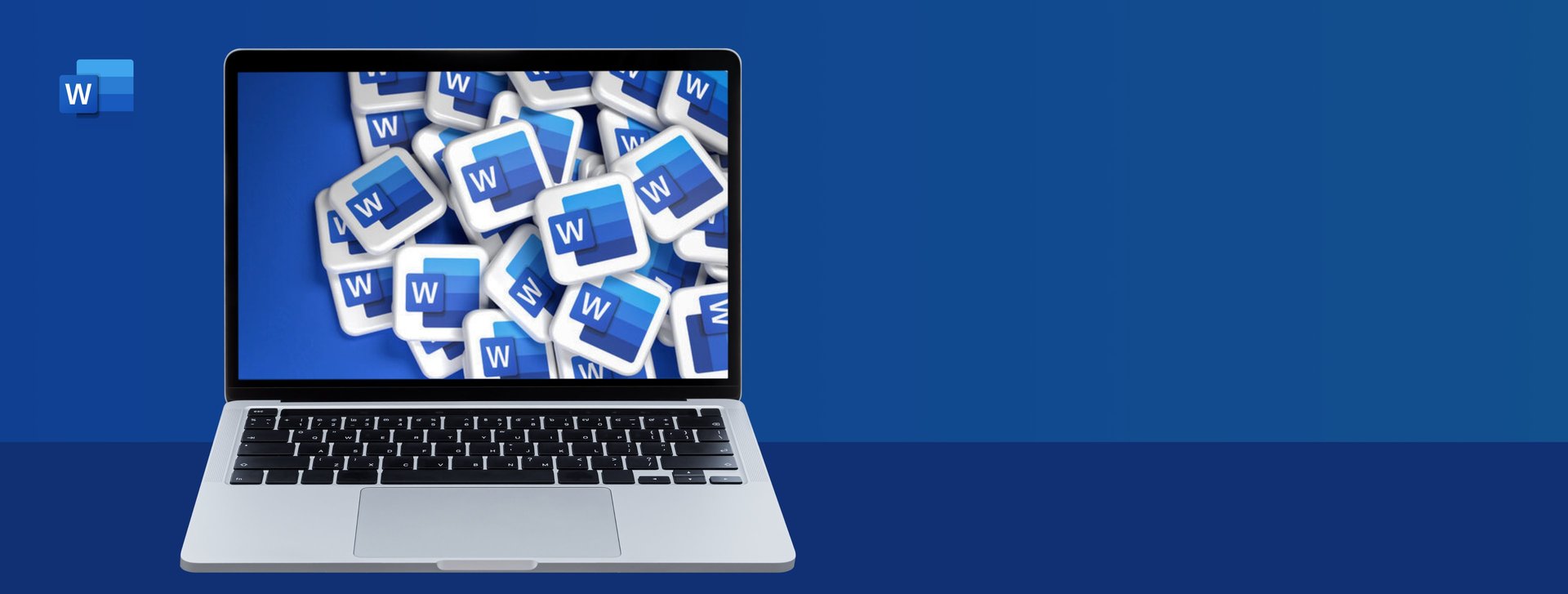 Person sitting on a table clicking on their Surface laptop