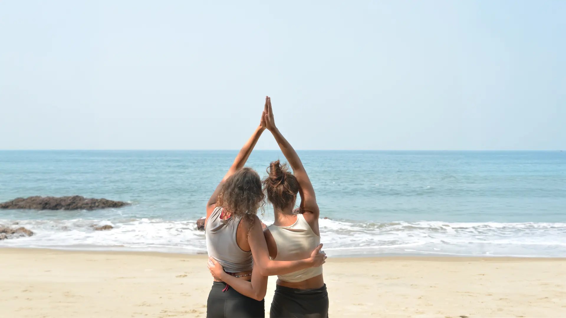 an abstract photo of a curved building with a blue sky in the background