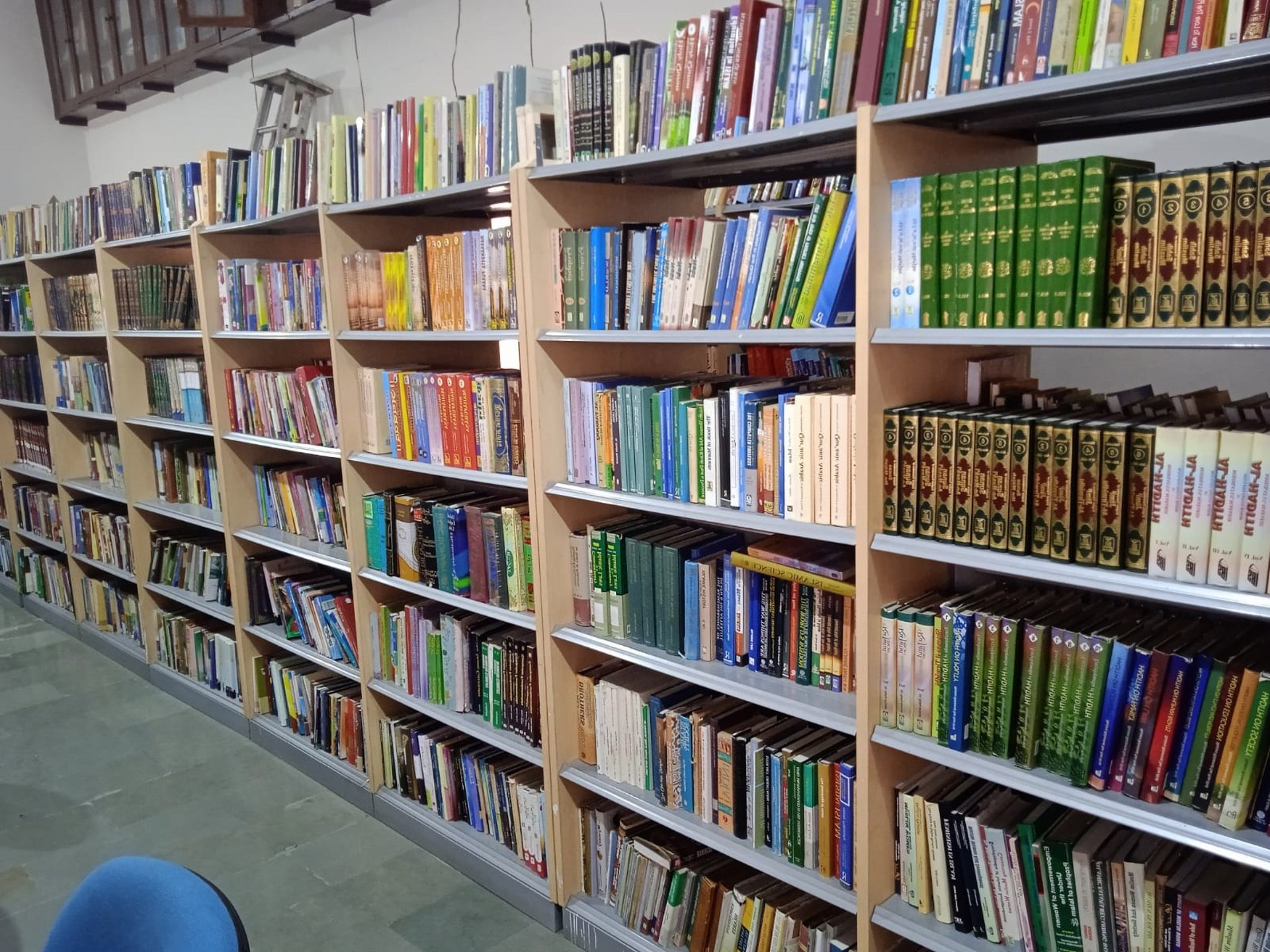 books on brown wooden shelf