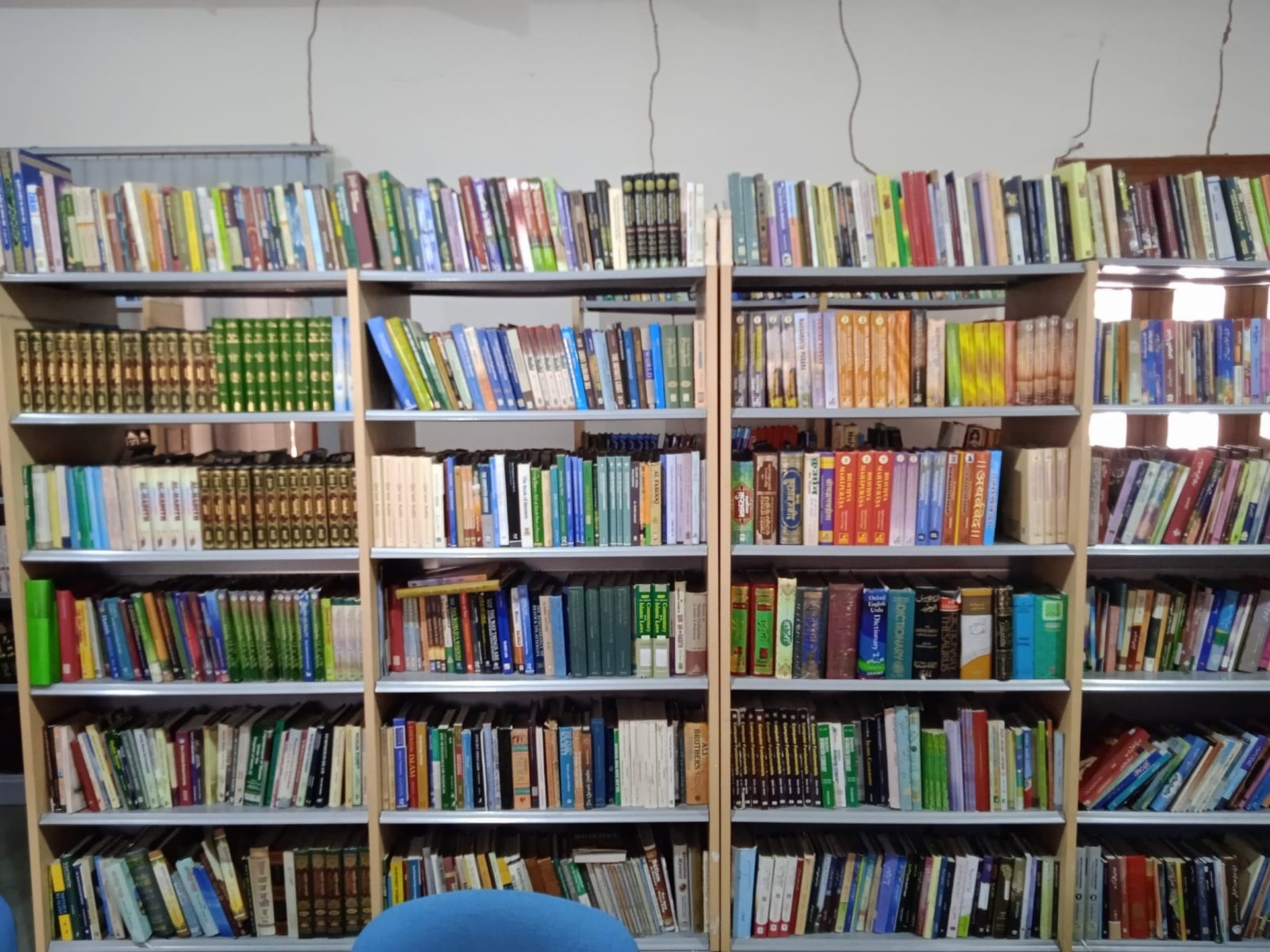 books on brown wooden shelf